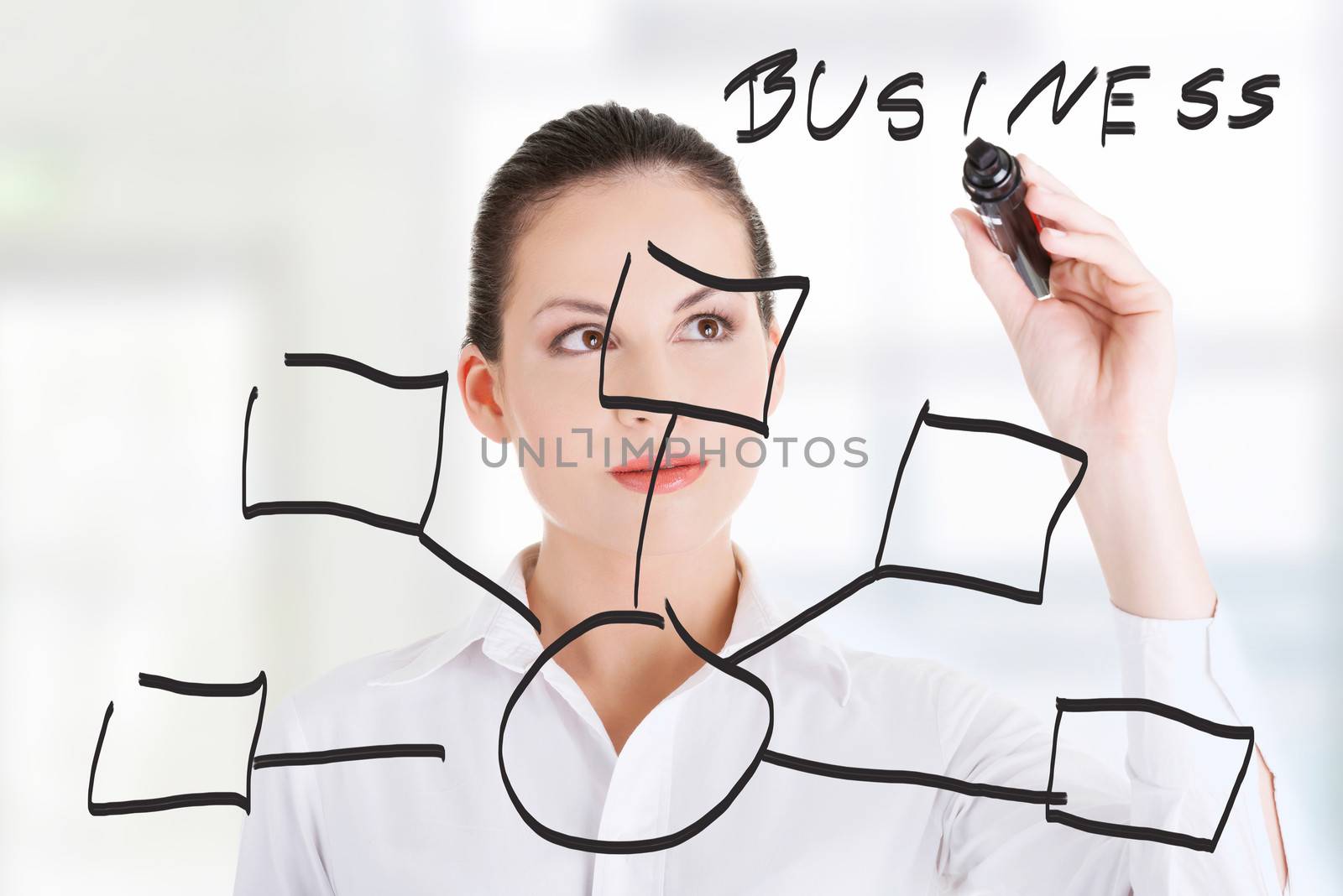 Young businesswoman writing something on abstract screen