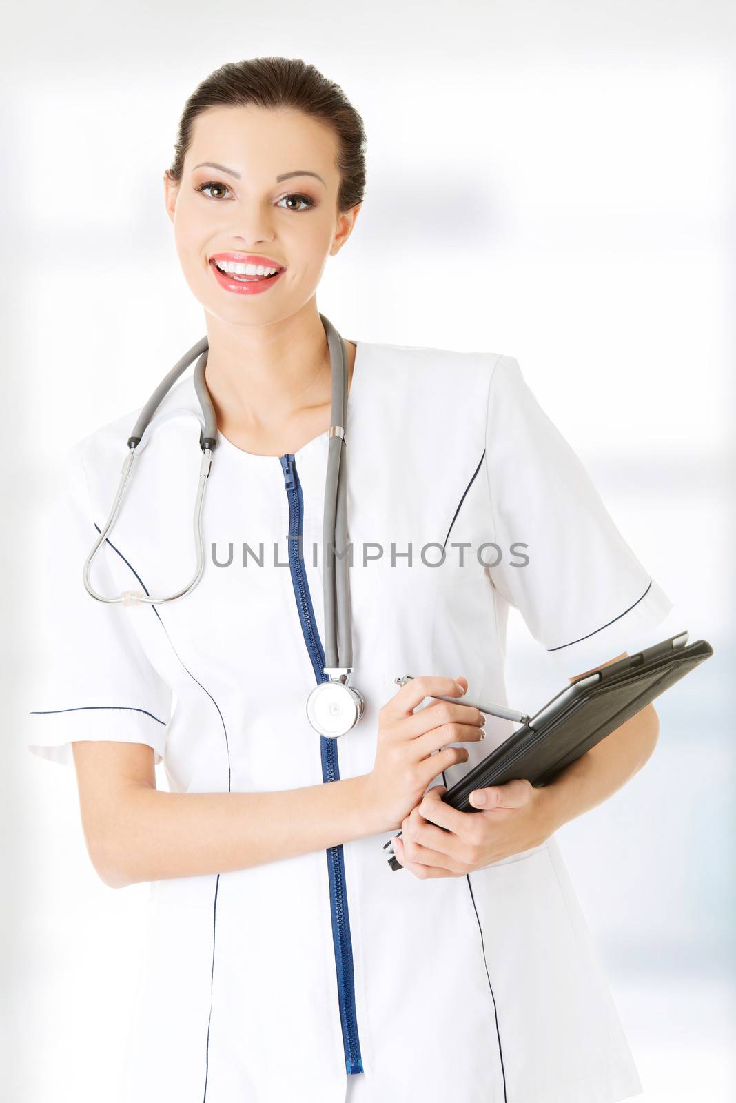 Female doctor using tablet computer , isolated on white.