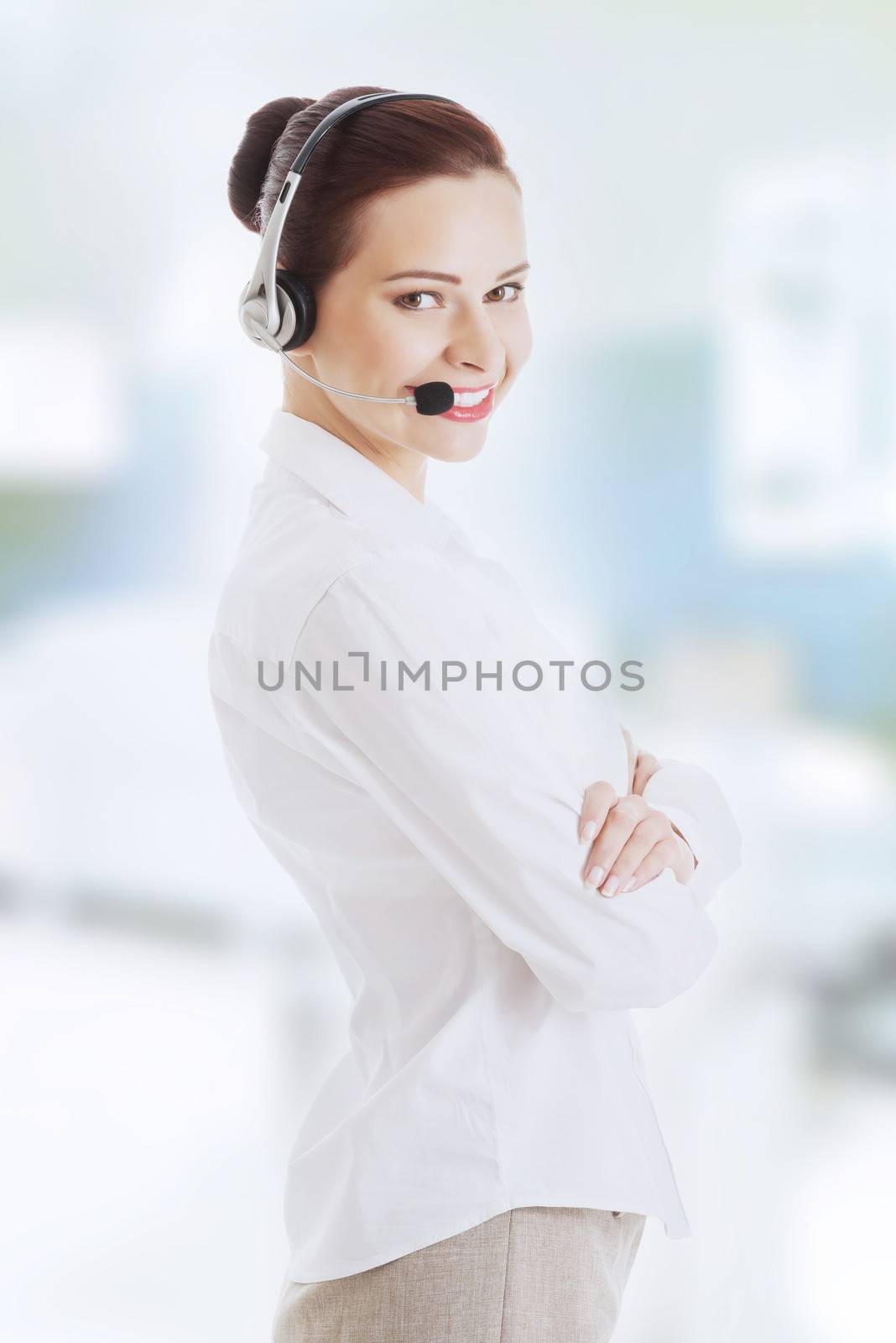 Beautiful woman on call center with microphone and headphones. by BDS