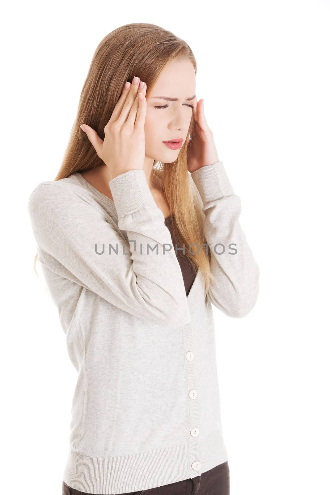 Beautiful woman's portrait, having headache or worried, sad. Isolated on white.