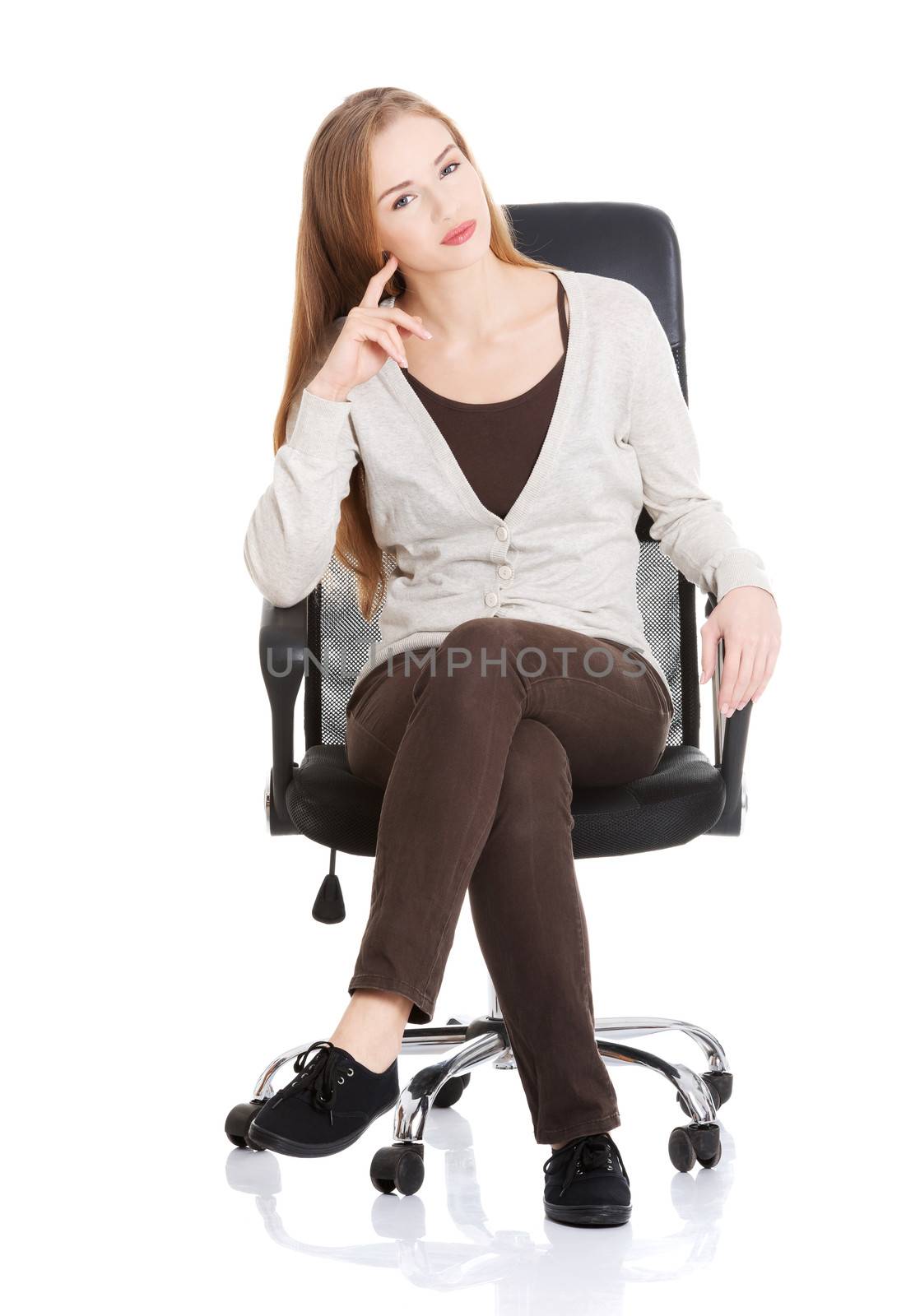 Beautiful casual woman sitting on a chair. by BDS