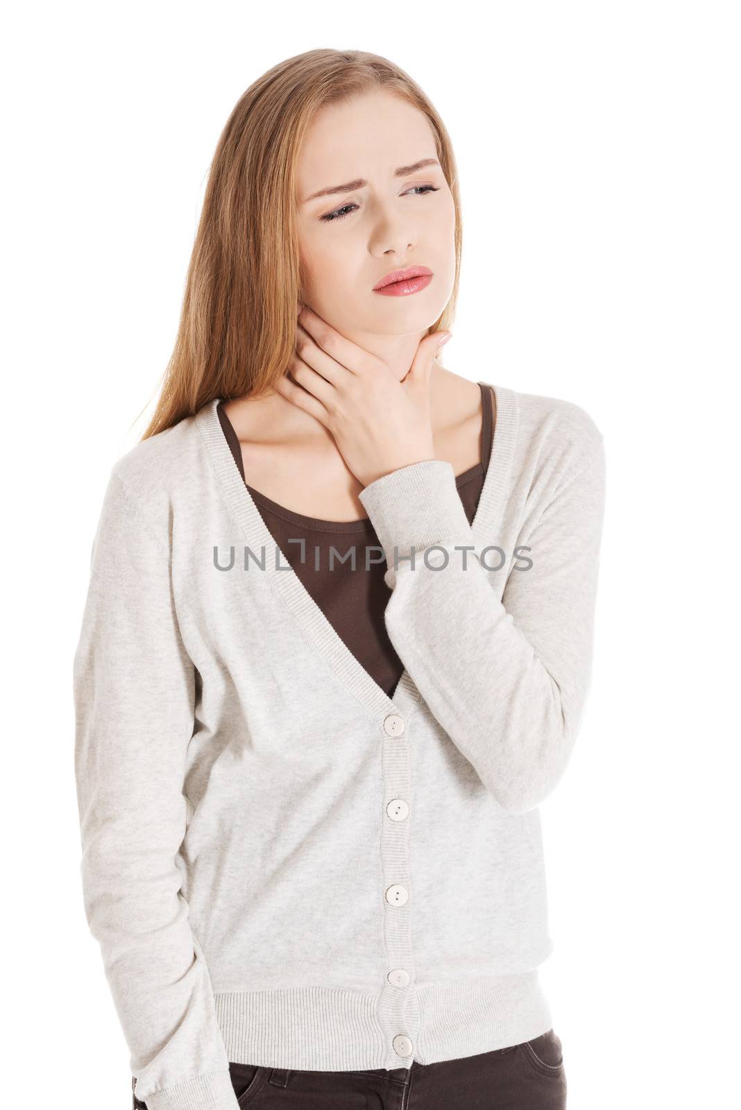 Beautiful casual woman is having sore throat. Isolated on white.