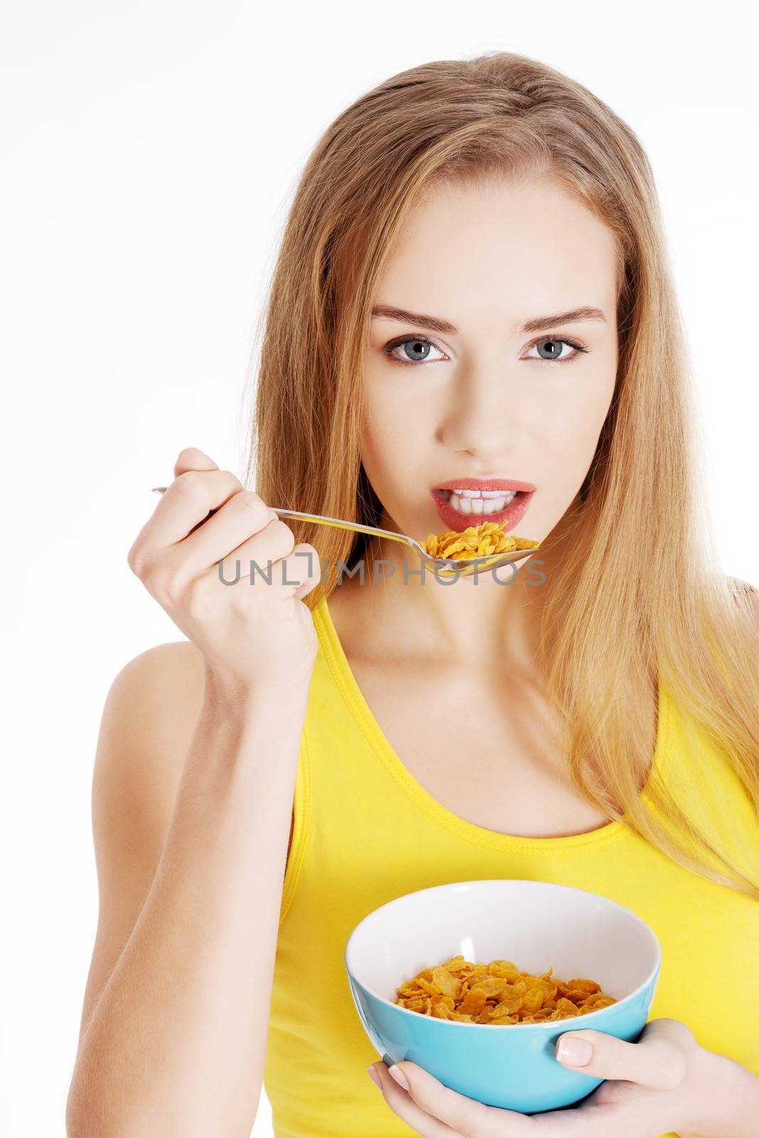 Beautiful caucasian woman eating cereals. by BDS