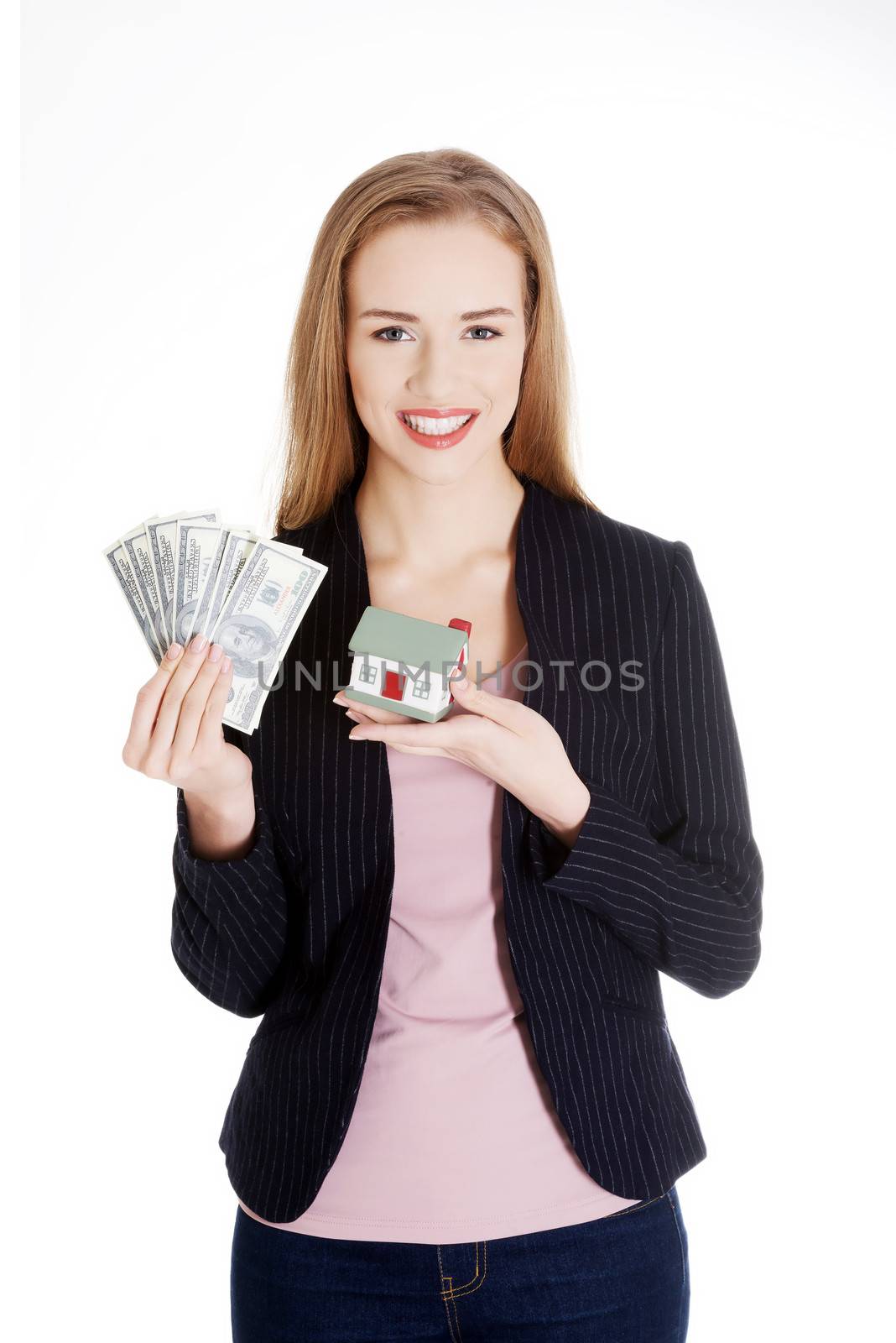 Beautiful business woman holding dollar currency and house. Isolated on white.