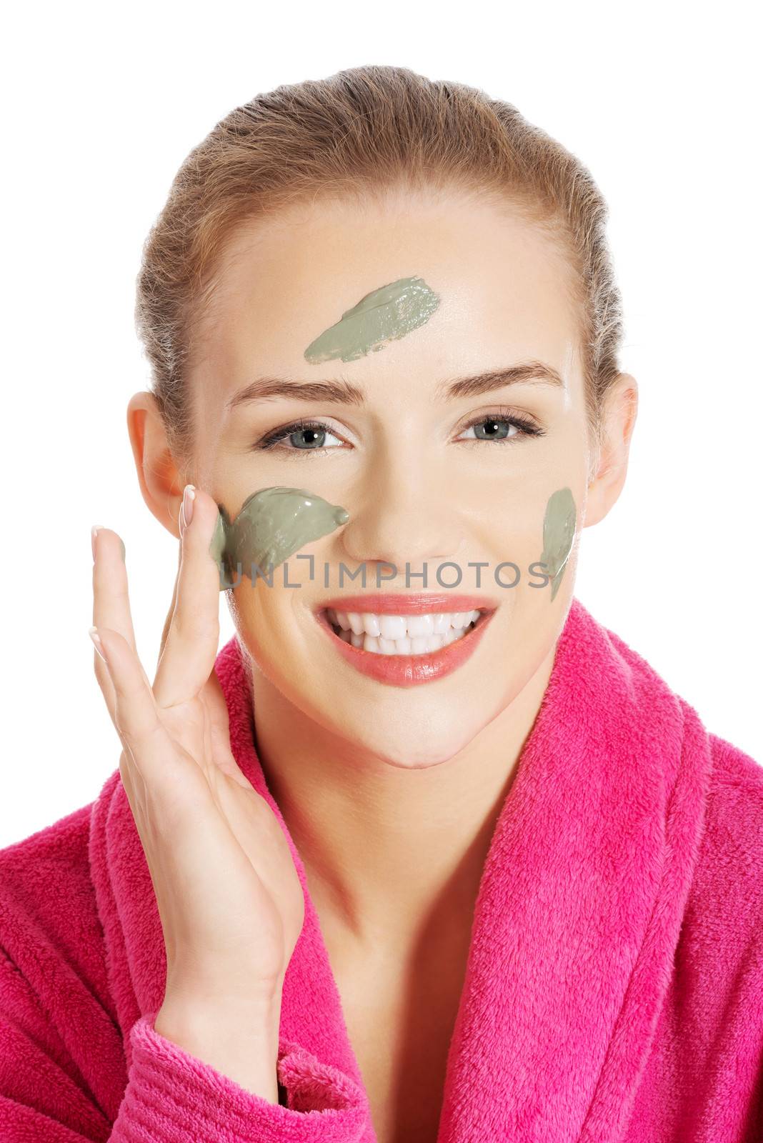 Beautiful caucasian woman with facial mask on face. by BDS