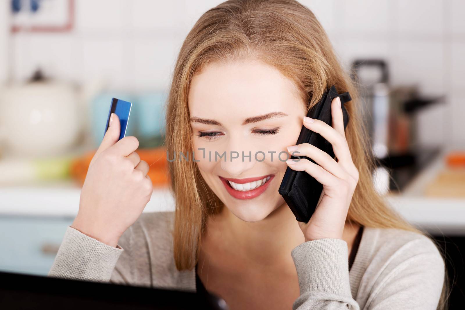 Beautiful caucasian woman talking through phone and working with by BDS