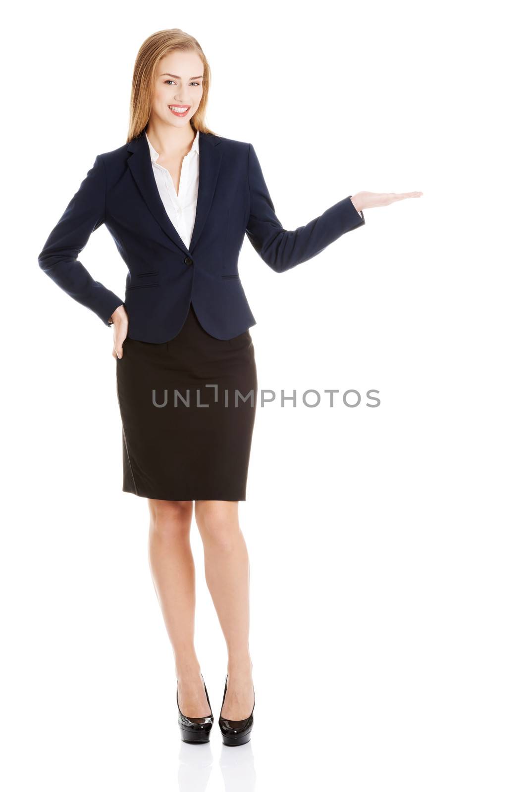 Beautiful business woman showing copy space on palms. by BDS