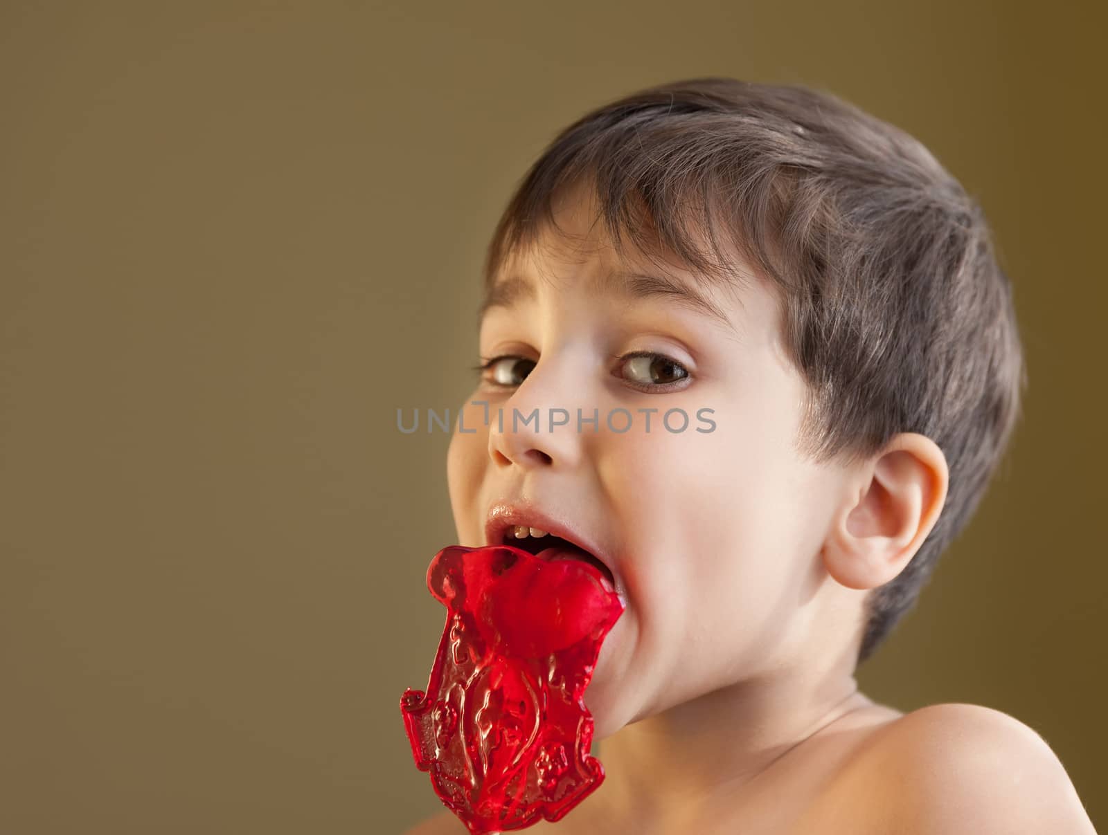 Boy Eating A Lollipop by palinchak