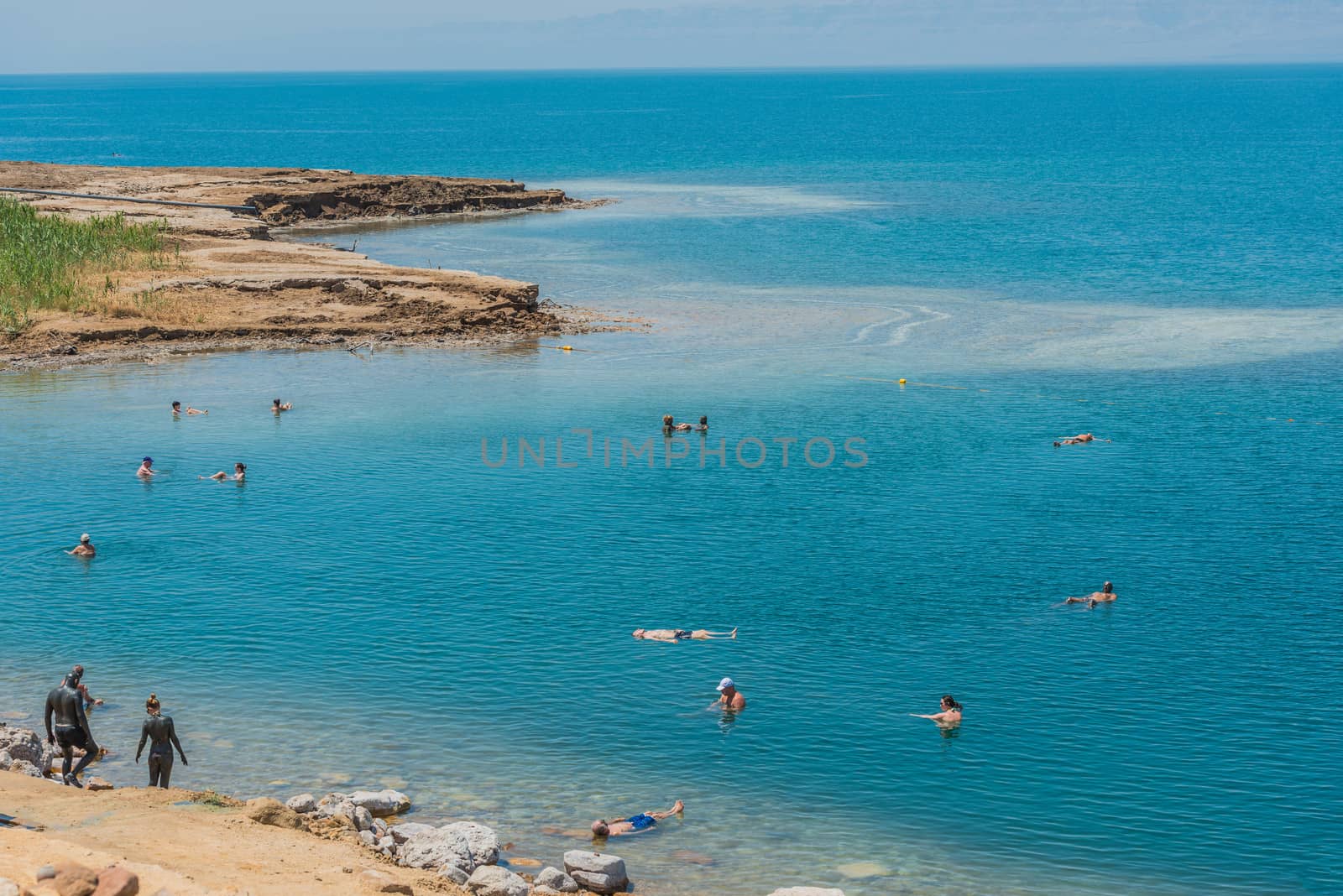 Dead Sea, Jordan - May 6, 2013 people swimming bathing in dead sea jordan