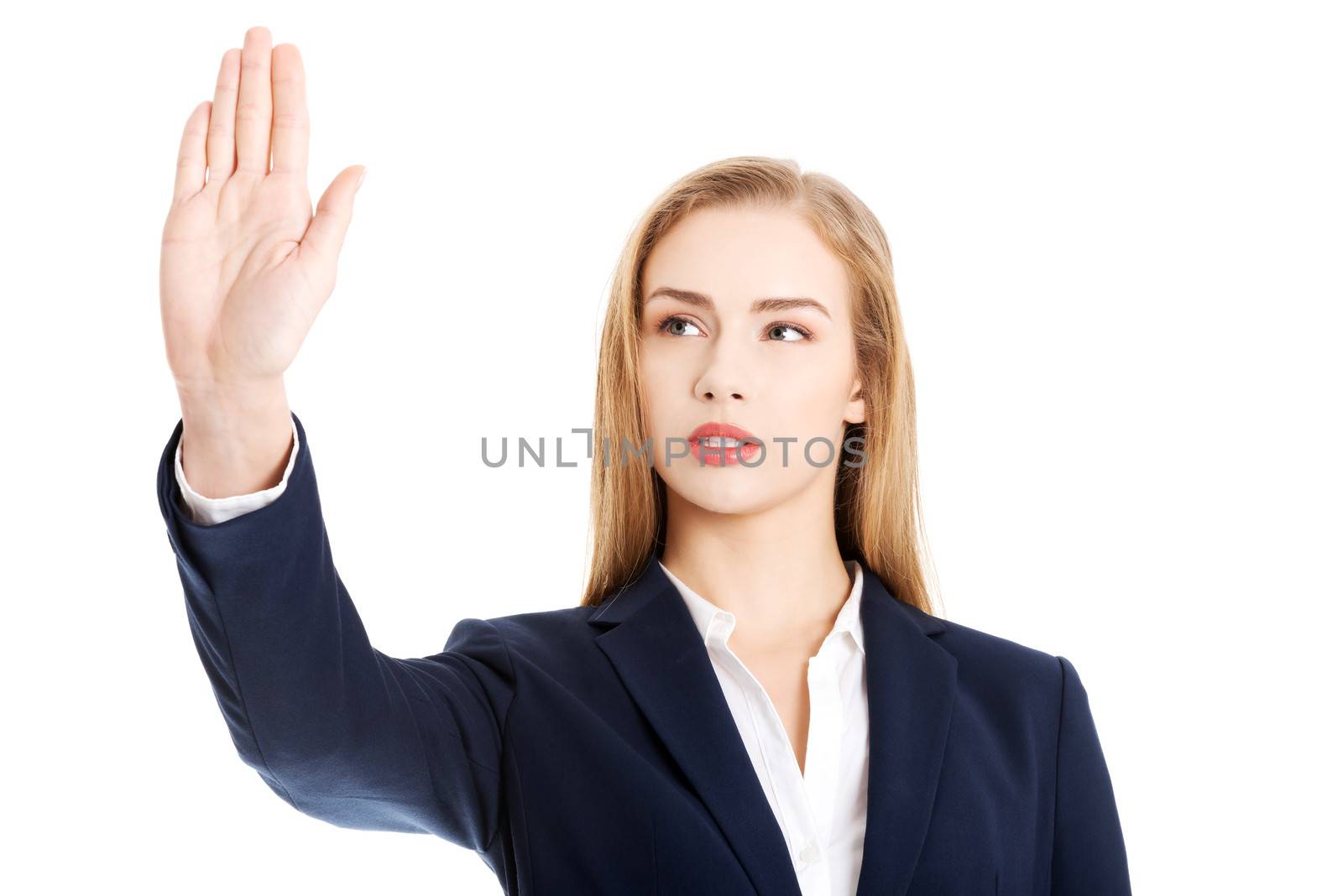 Beautiful business woman is having had up showing stop gesture. Isolated on white.