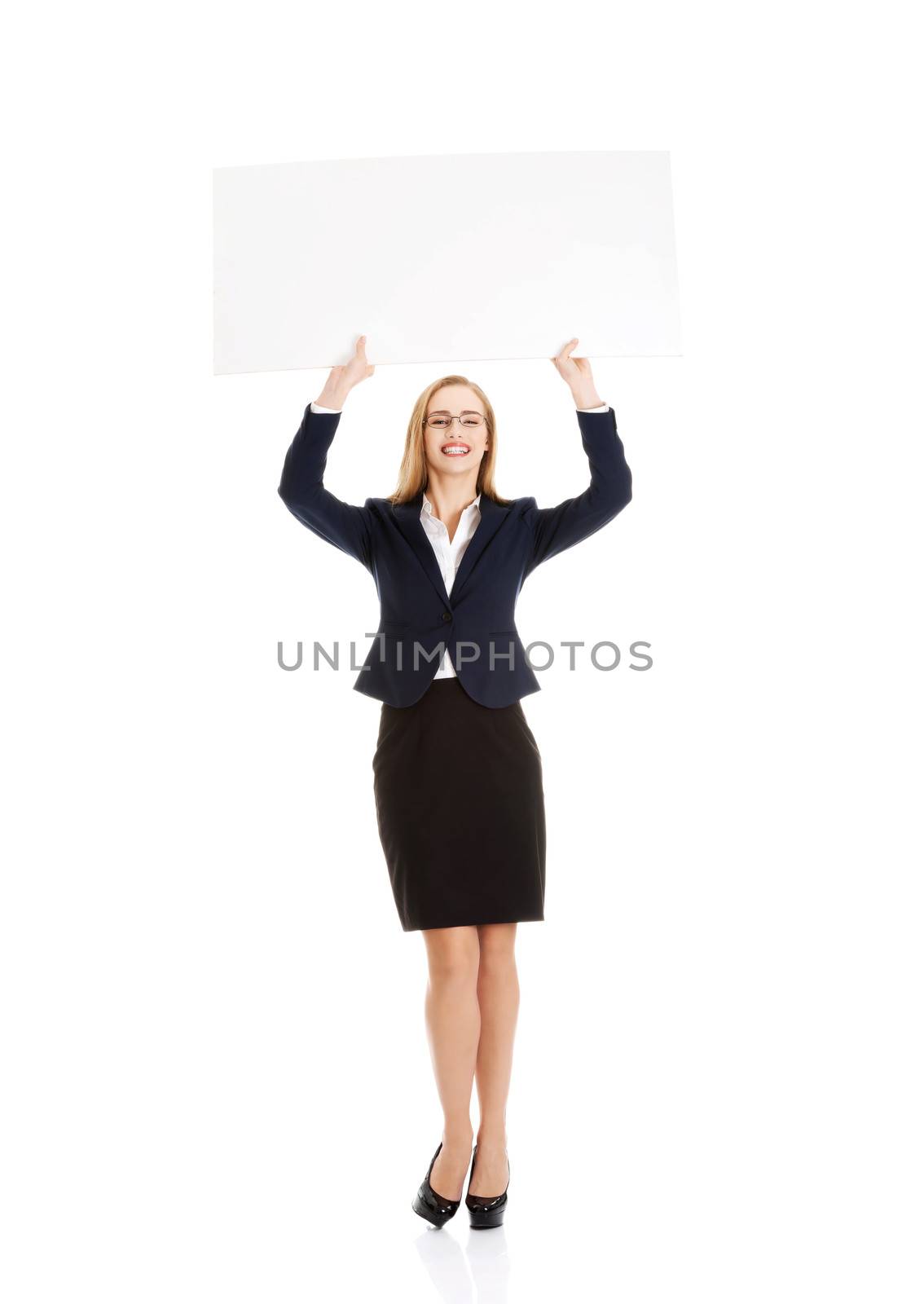 Beautiful young business woman holding copy space. by BDS