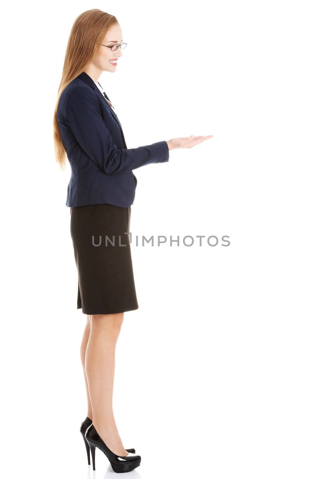 Beautiful business woman with copy space on her hand. Isolated on white.