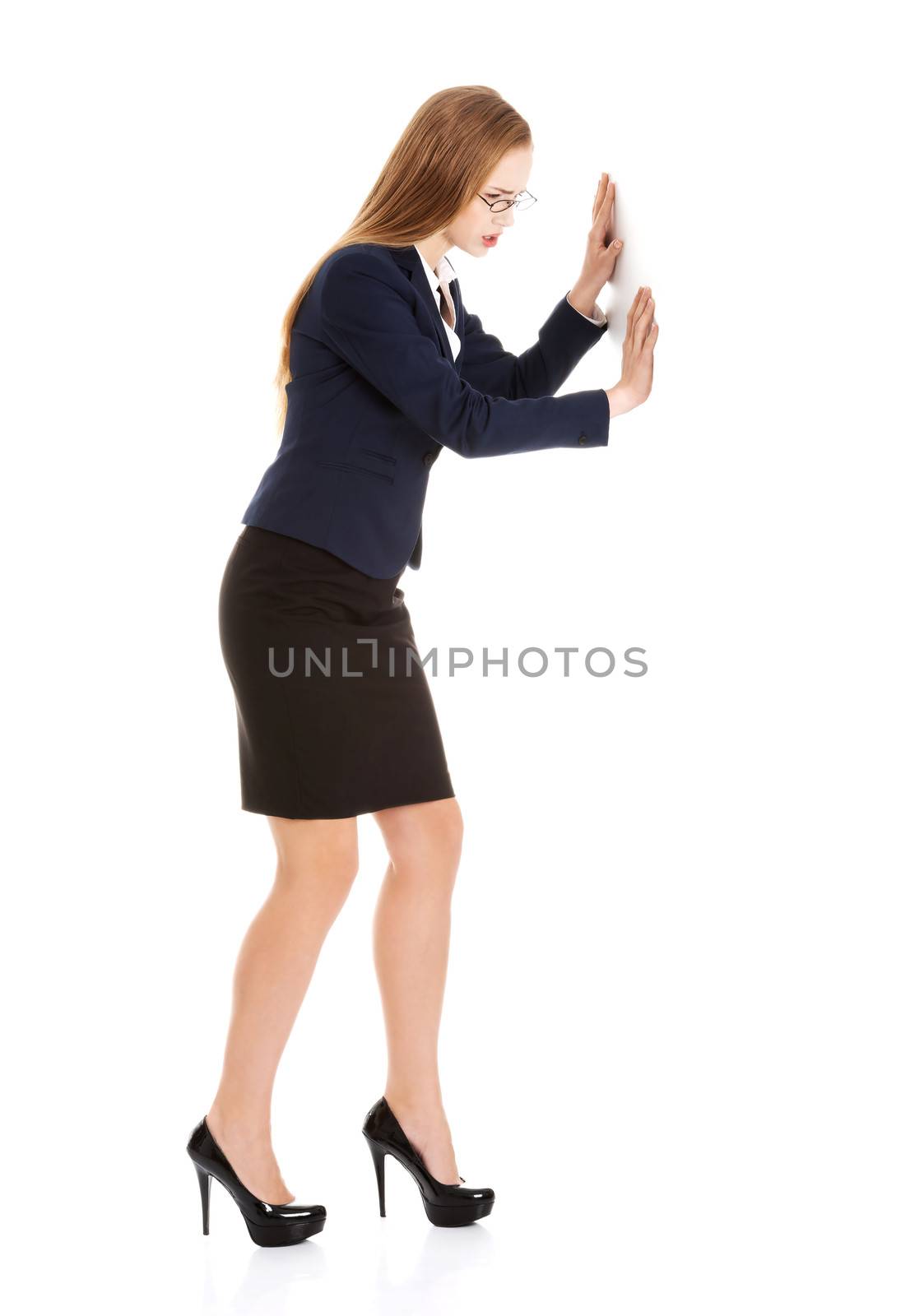 Beautiful business woman pushing copy space. Isolated on white.