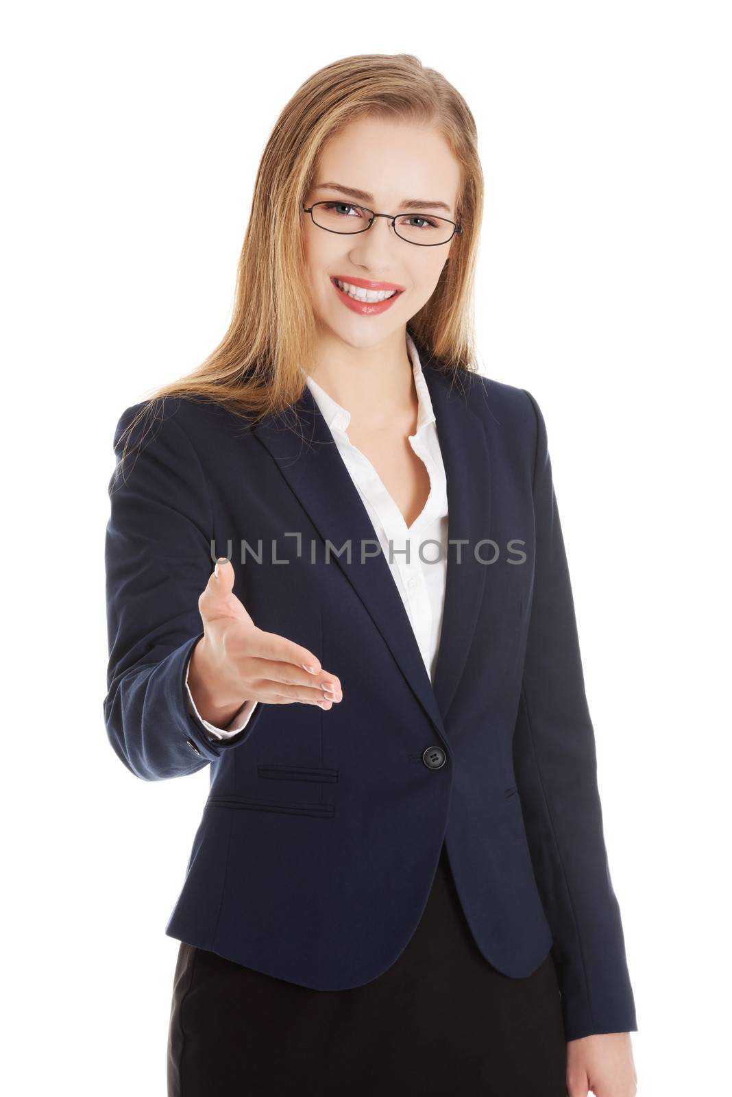 Beautiful caucasian business woman giving a hand. Isolated on white.