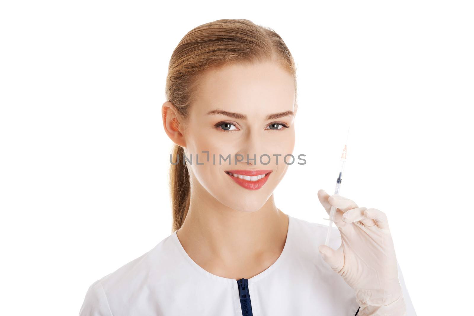 Beautiful young doctor or nurse is holding a needle. Isolated on white.