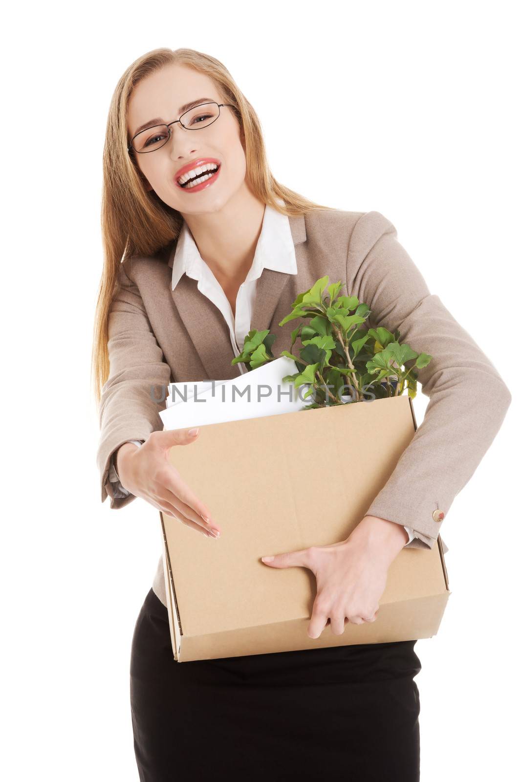 Beautiful business woman holding box with office items. by BDS