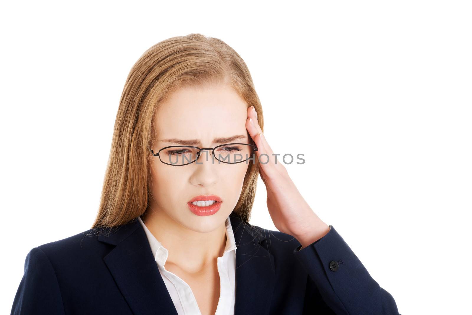 Beautiful business woman is having a headache. Isolated on white.