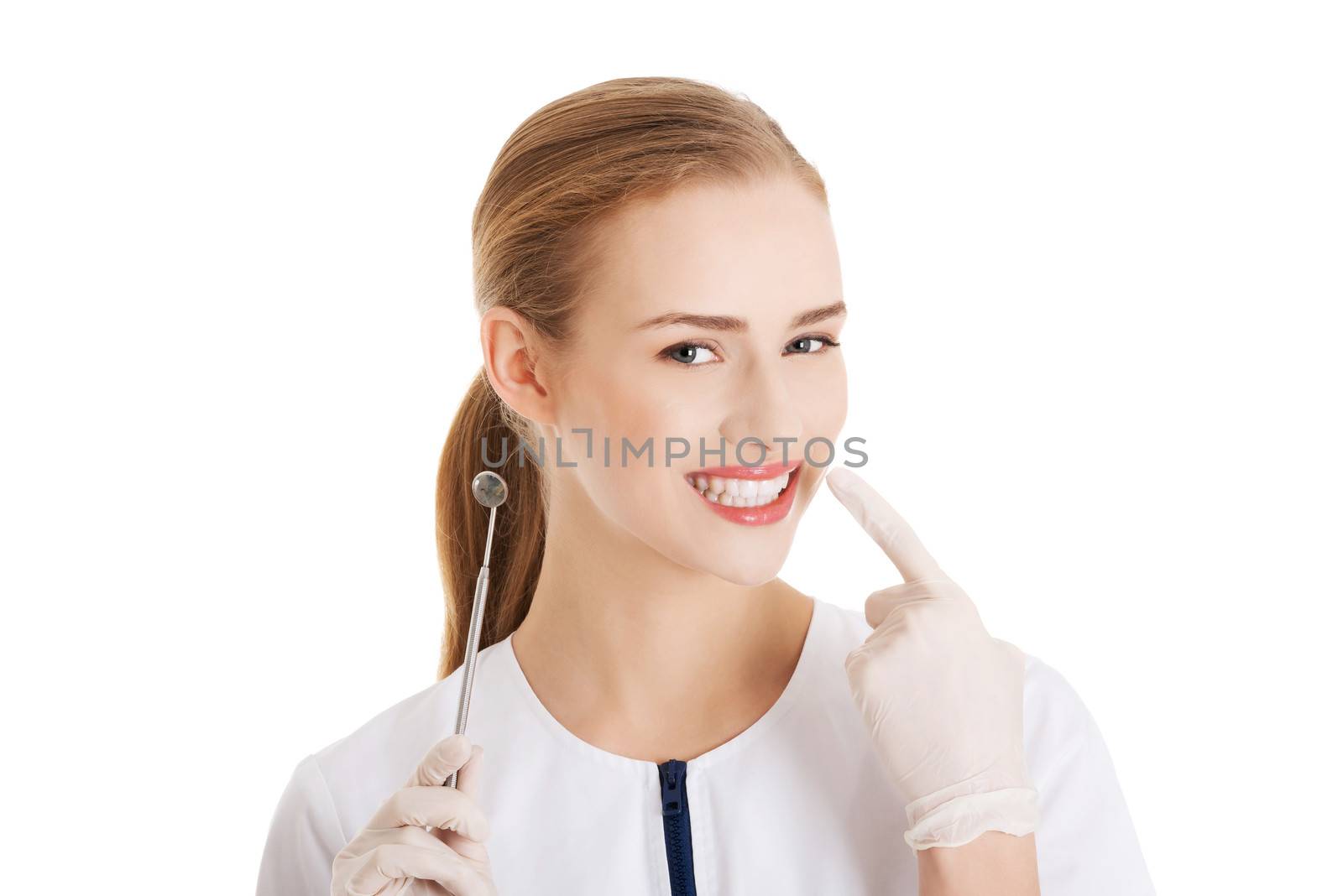 Young beautiful dentist woman with equipment. Isolated on white.
