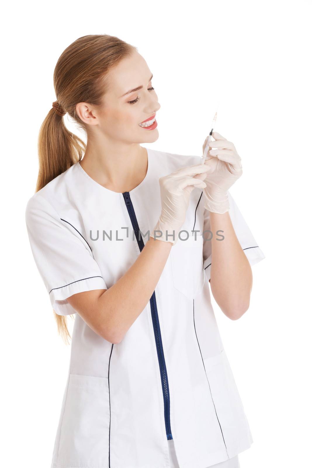Beautiful young nurse or doctor with needle, shot ready to apply. Isolated on white.