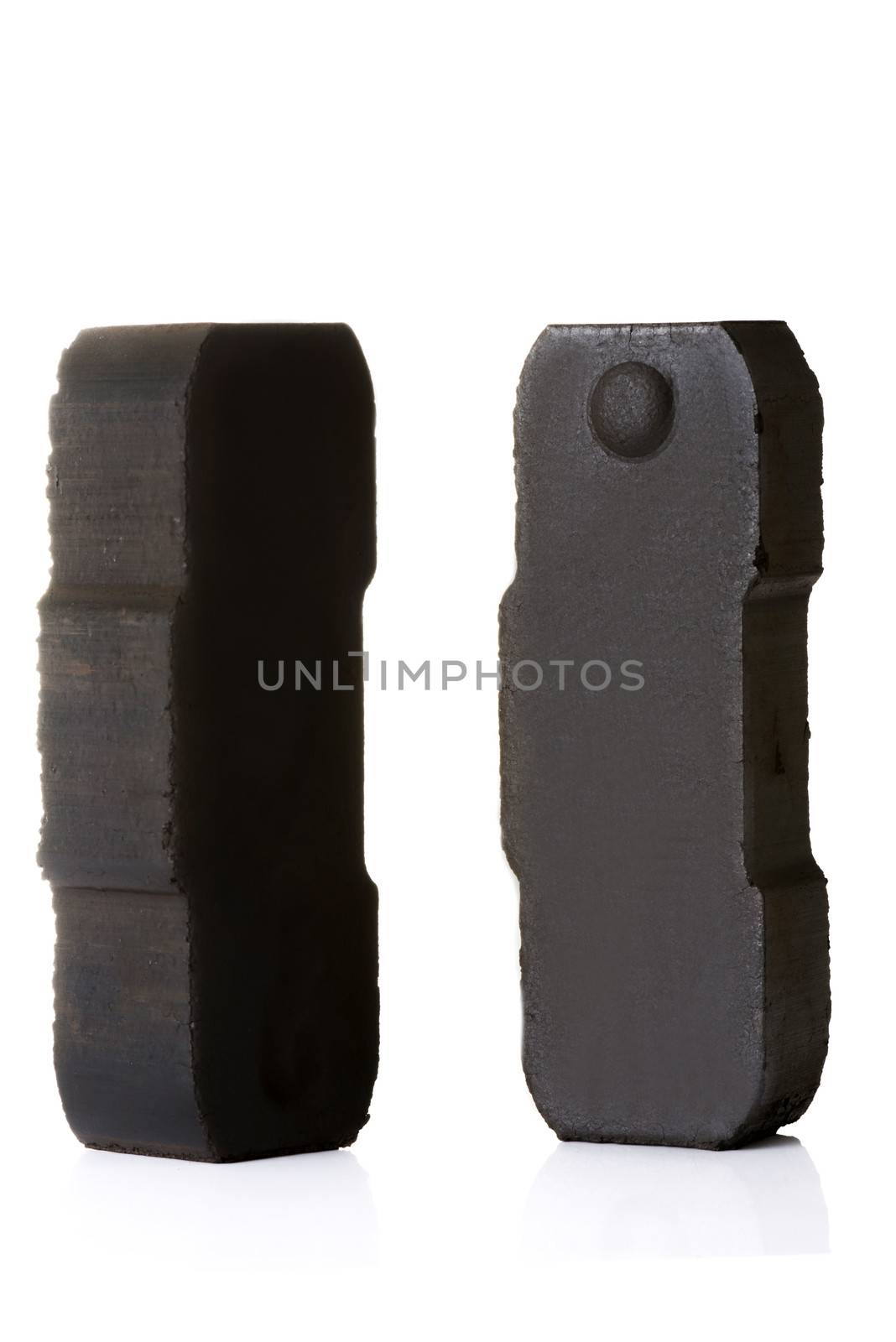Two pieces of black coal. Isolated on white.