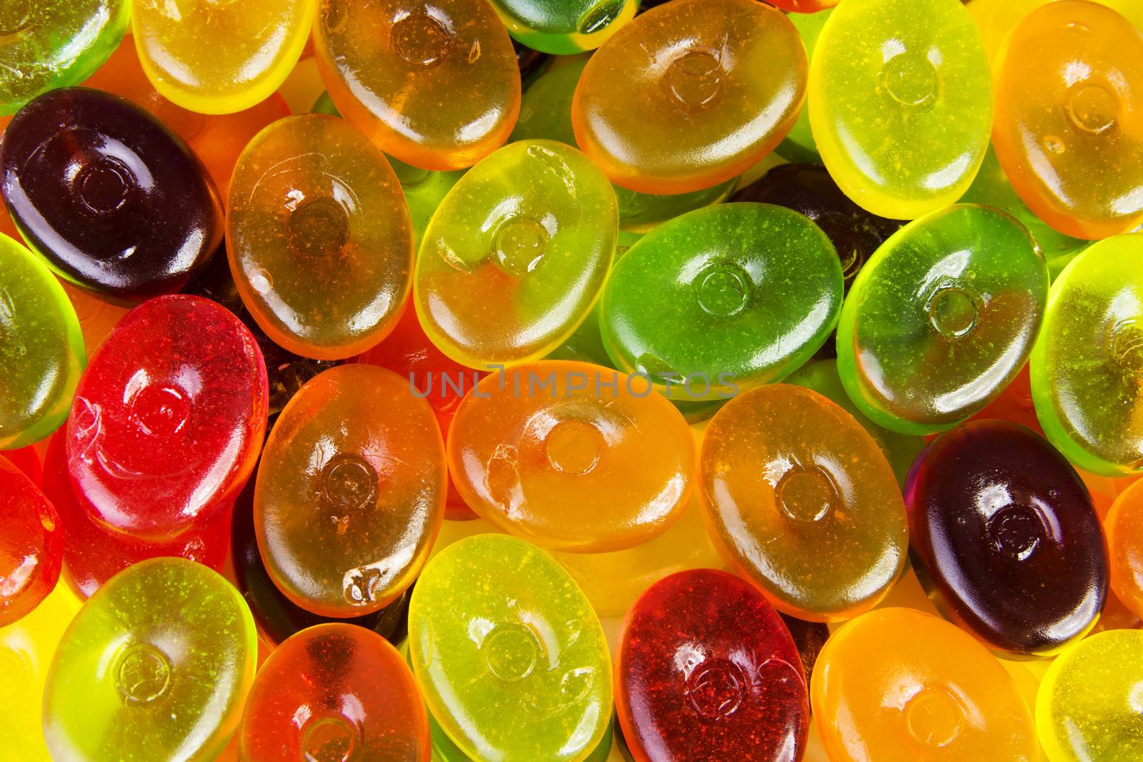 Close up on colorful boiled sweets. Up front view.