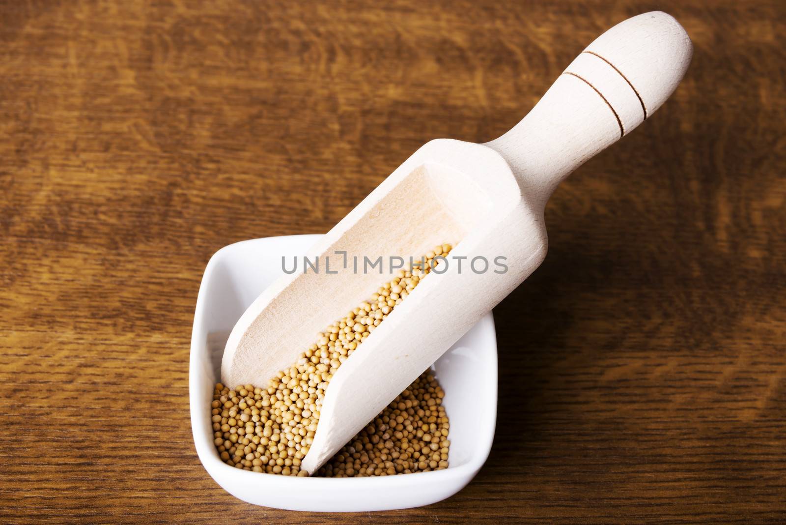 Peas or lentil in a bowl. Up front view. Standing over wooden table.