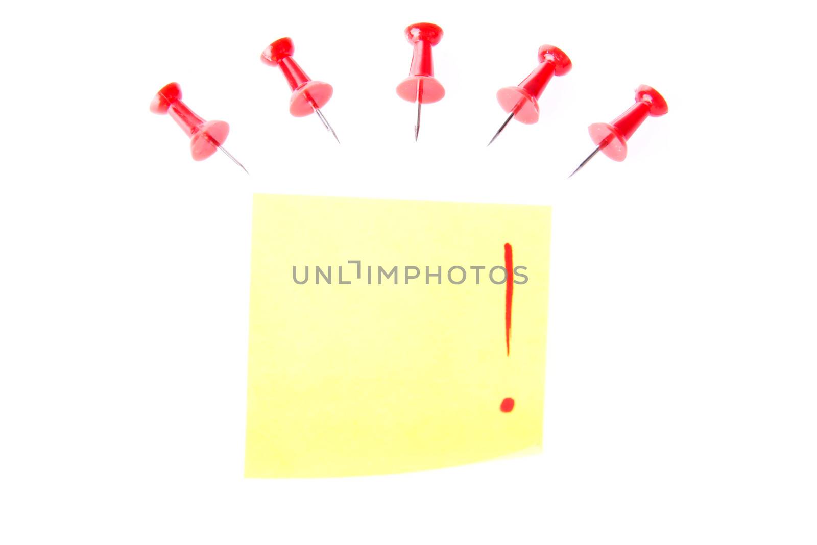 Red drawning pins with yellow memo. isolated on white.