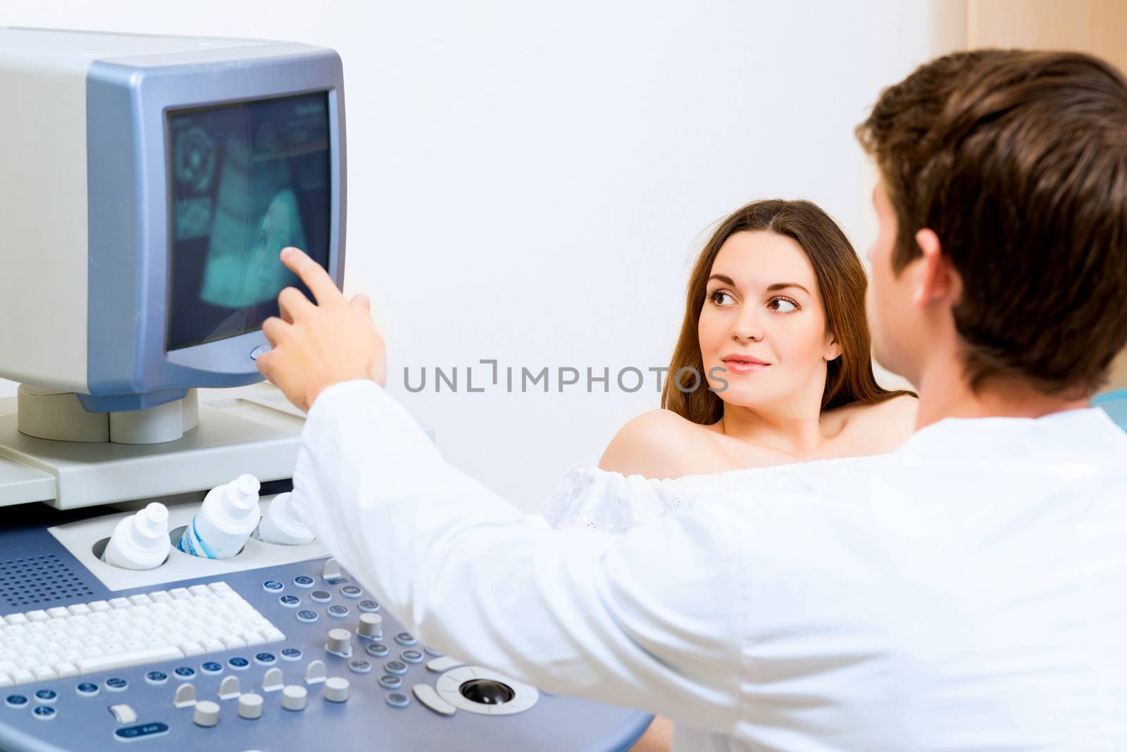 pregnant woman on reception at the doctor by adam121