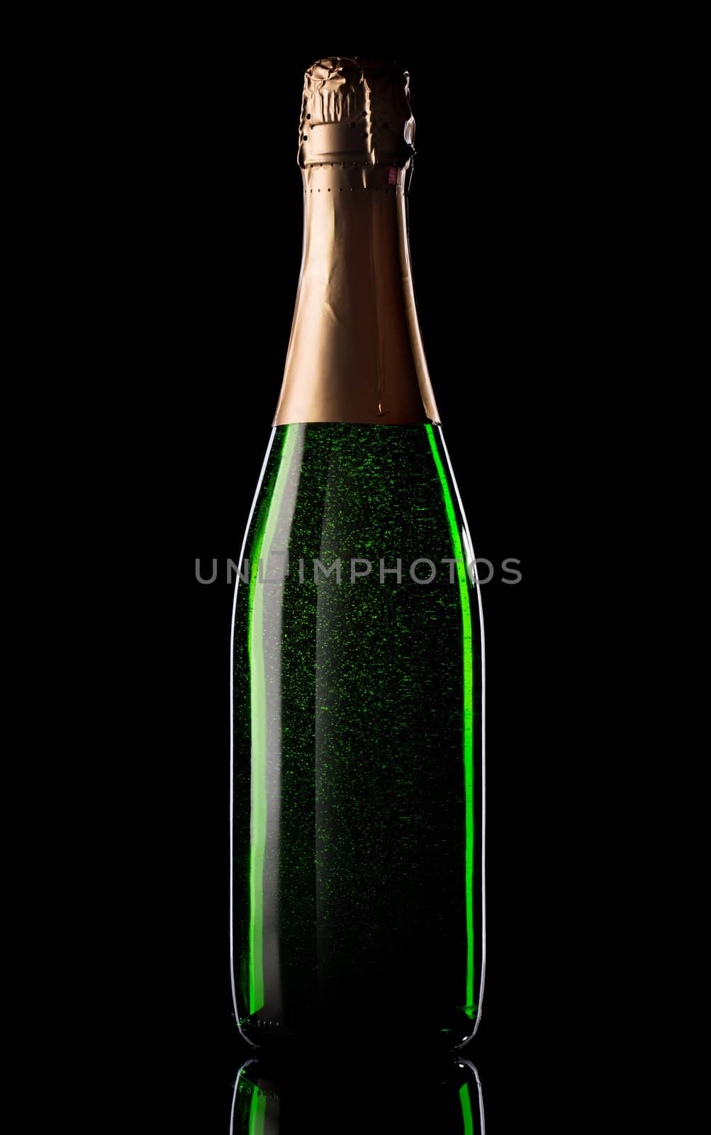 Green bottle of champagne on black background
