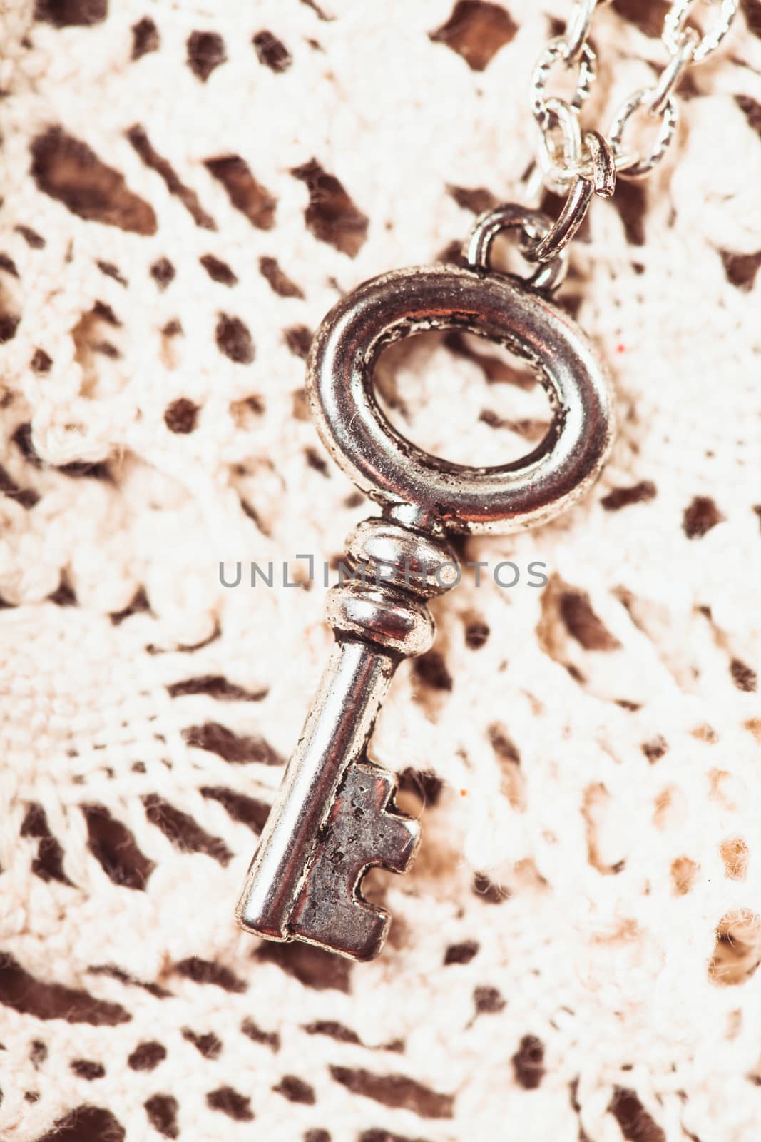 Vintage key on the white aged lace