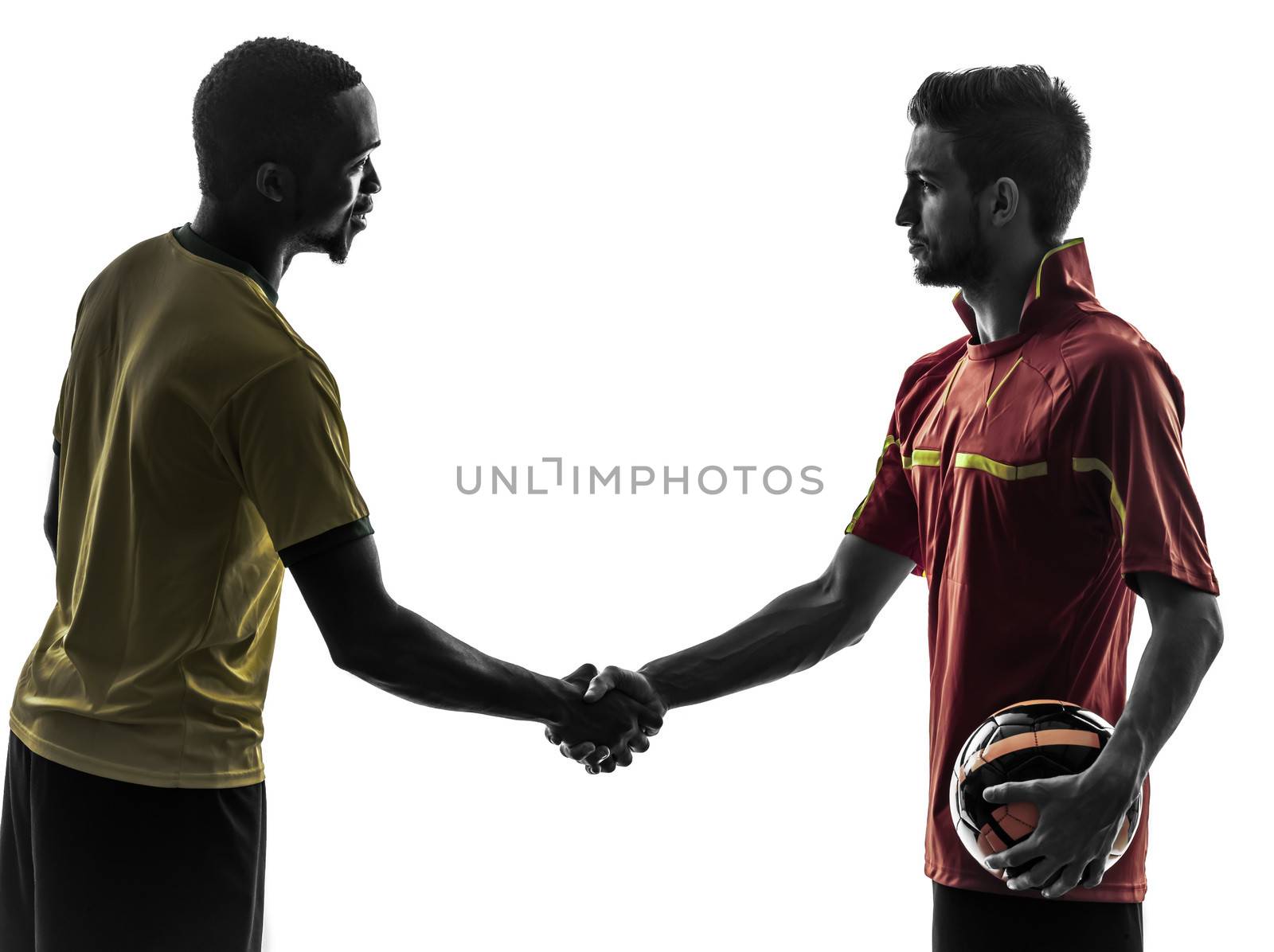 two men soccer player playing football competition handshake handshaking in silhouette on white background