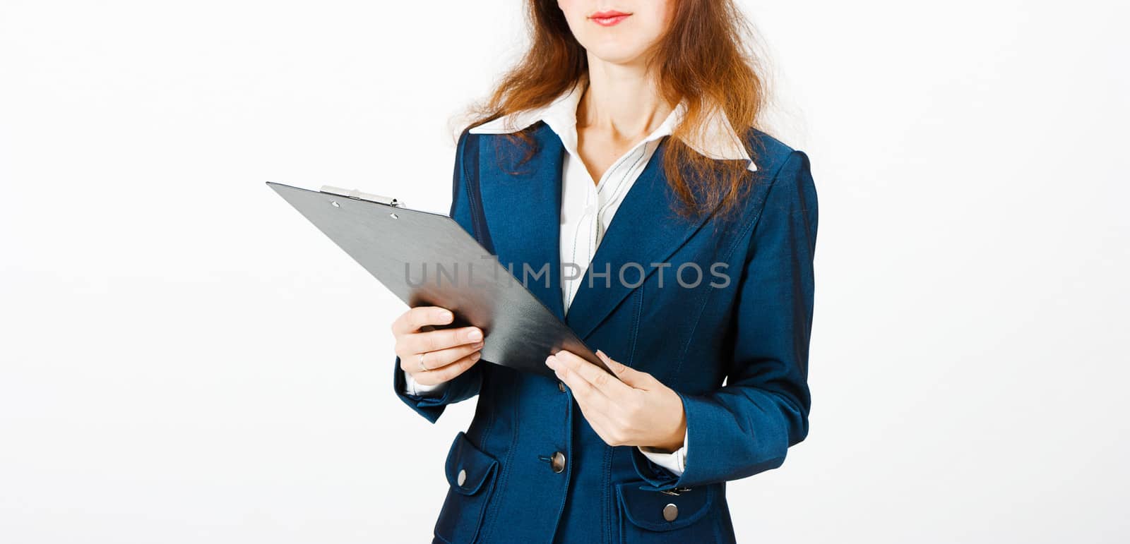 Young woman in a suit with a folder in hands