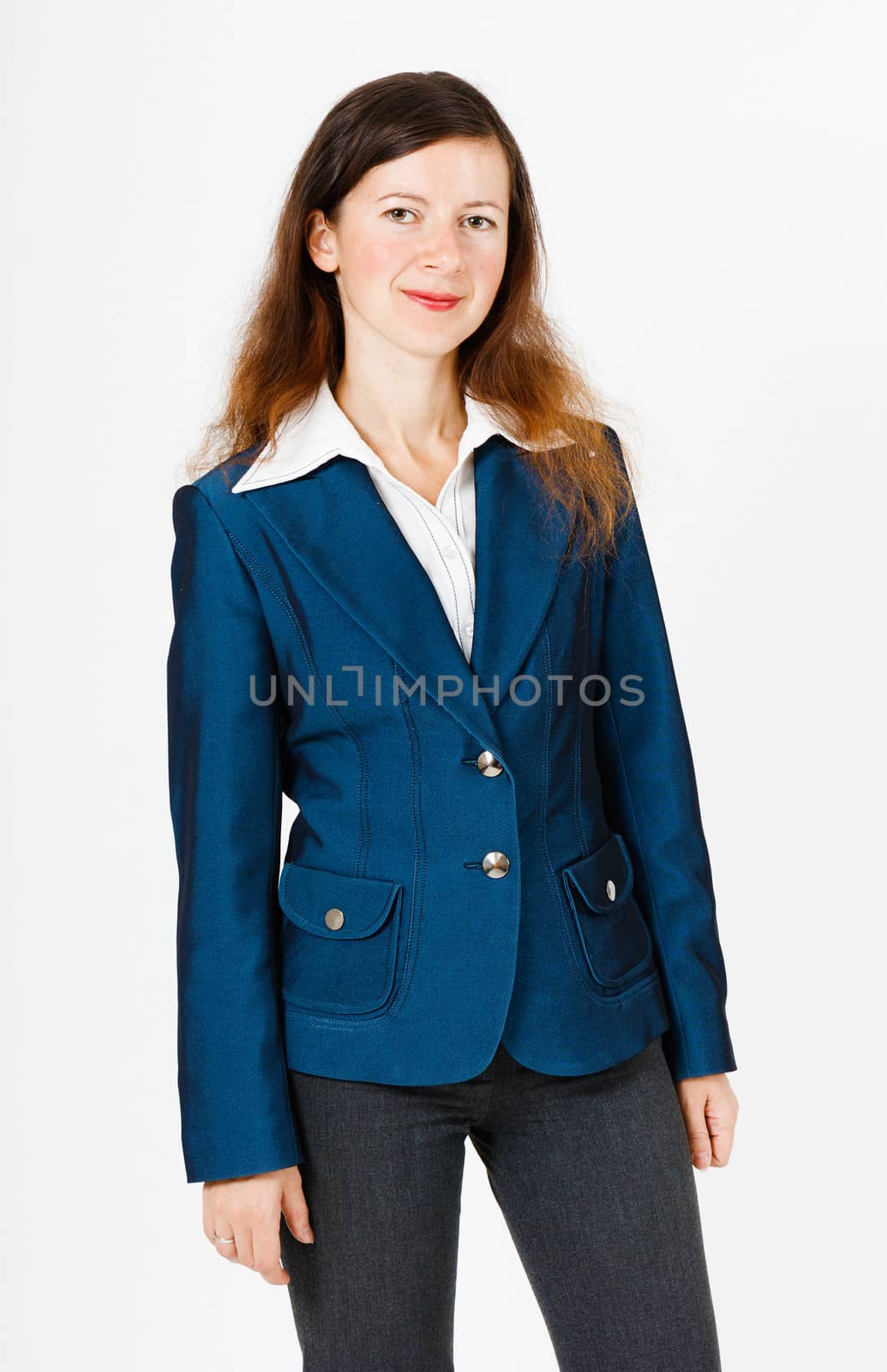 Young smiling woman in a suit standing