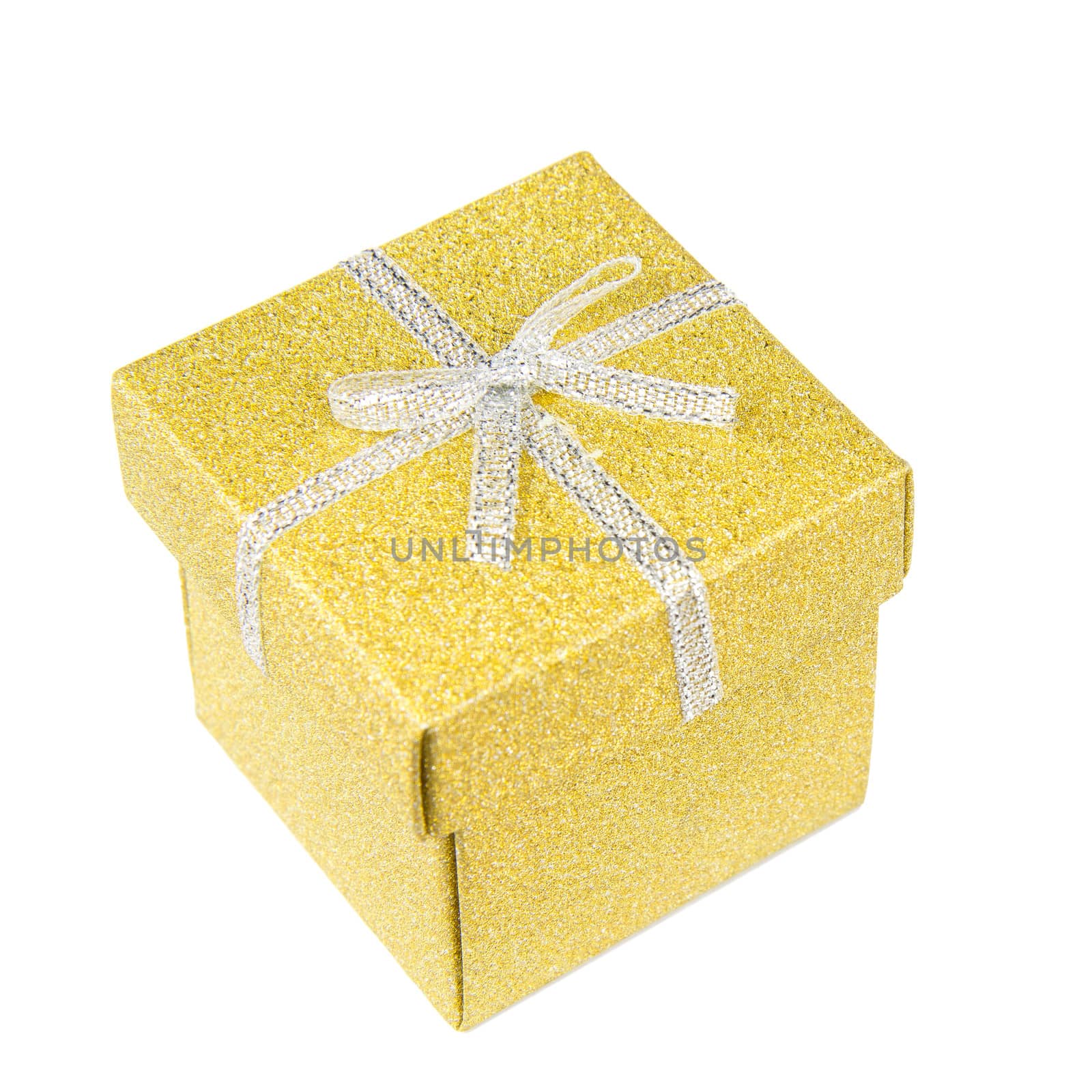 Golden, square, shiny gift box with silver ribbon on white background.