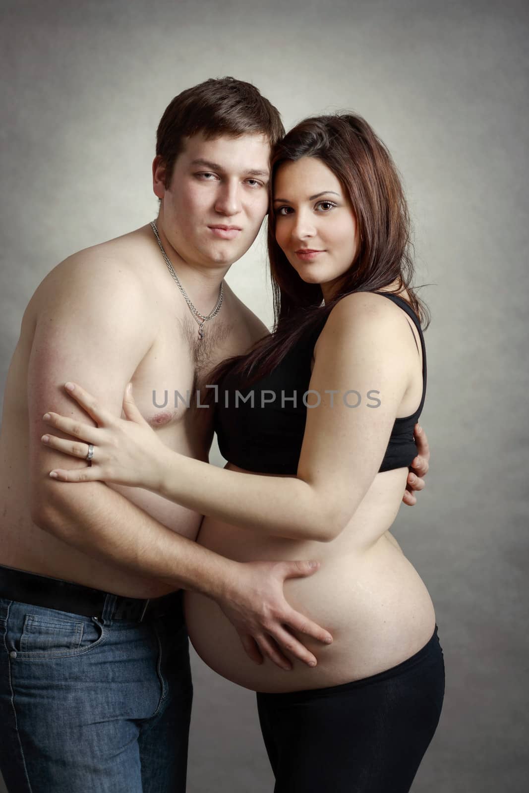 Loving happy couple, pregnant woman with her husband by artush