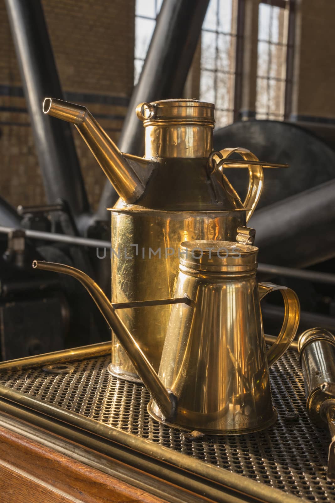 old copper industrial oil cans