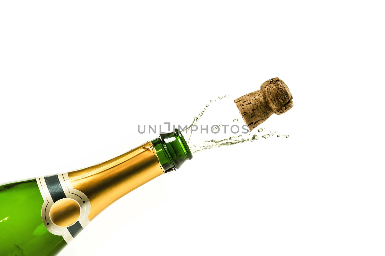 Bottle of champagne popping at new years eve