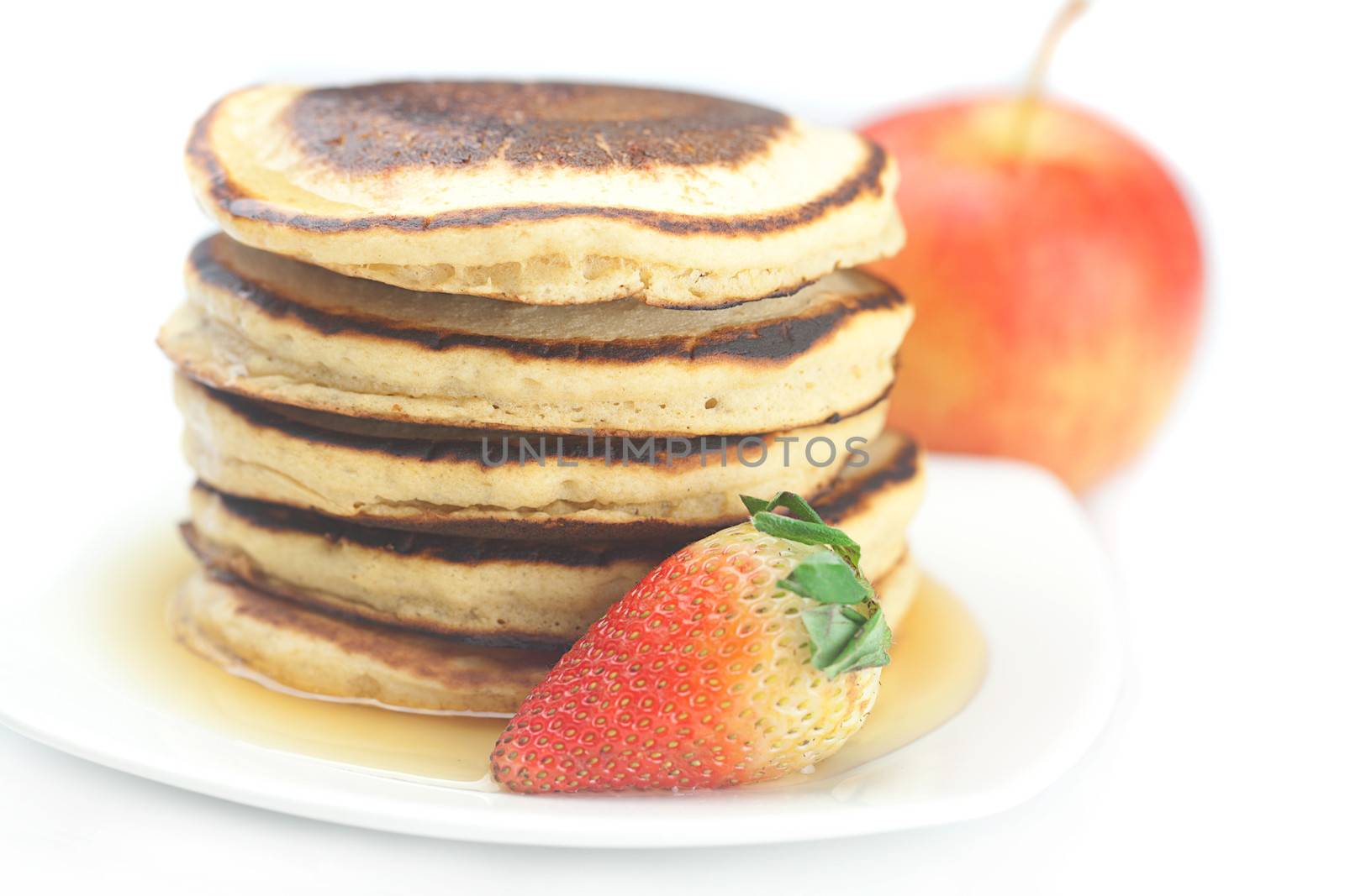 Pancakes,apple and strawberry isolated on white by jannyjus