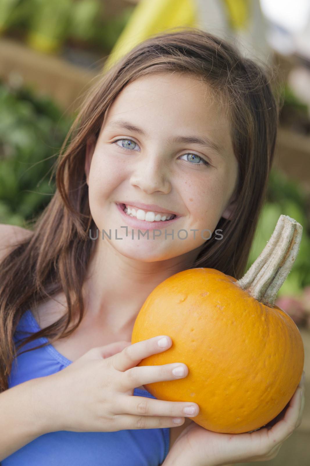 Pretty Young Girl Having Fun with the Pumpkins at Market by Feverpitched