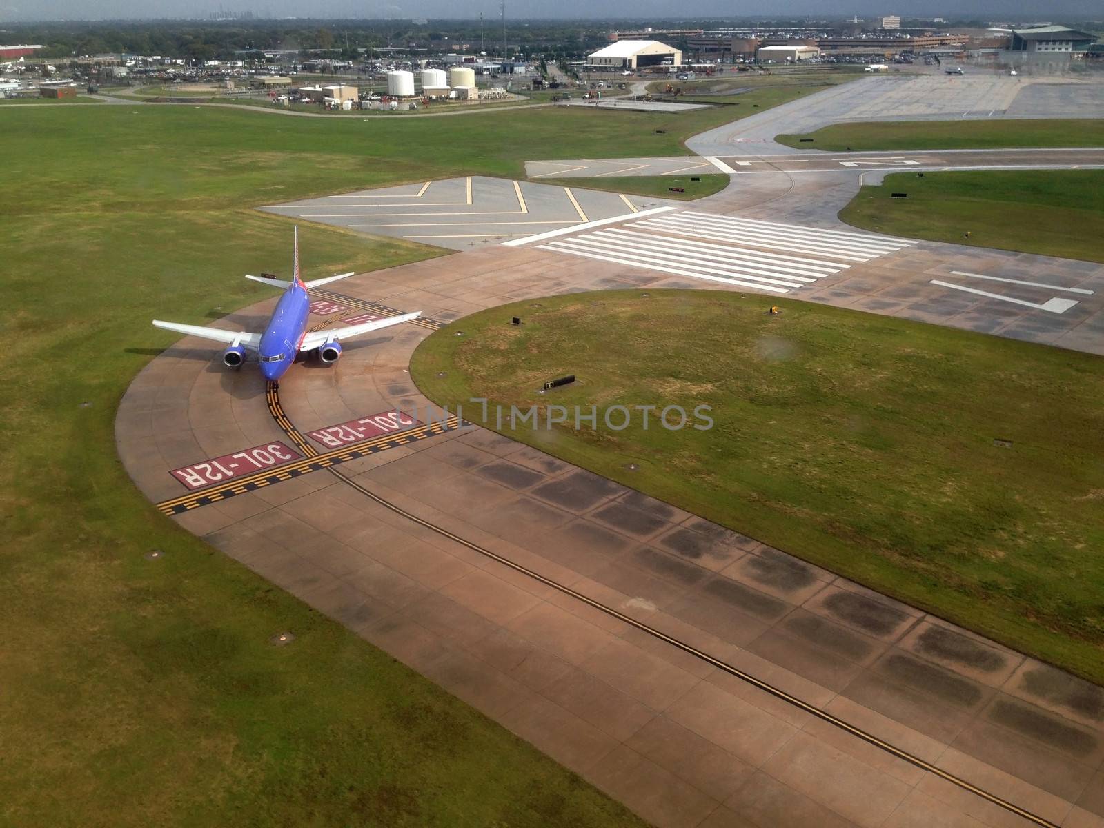 Airplane waiting to take off in an airport from above