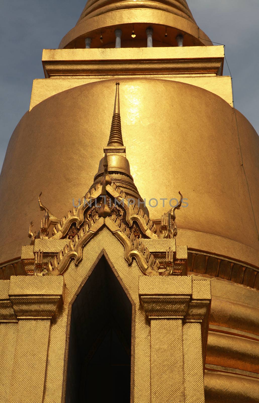 golden Buddhist temple gable by ssuaphoto