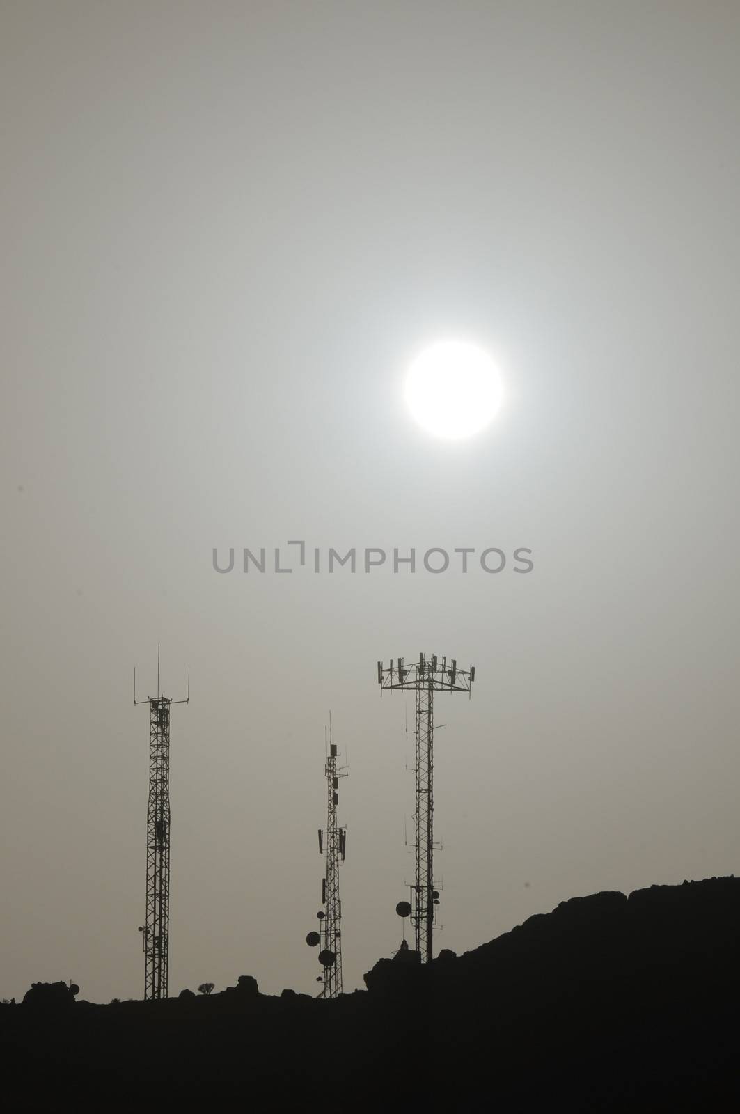 Some Silhouetted Antennas on the top of a Hill