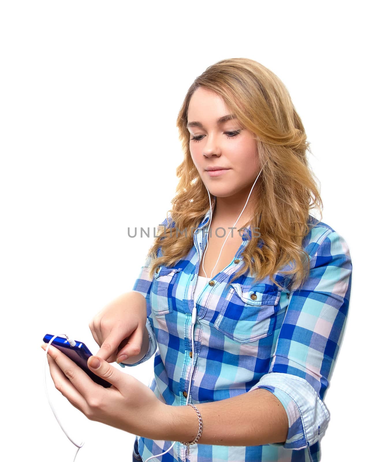 Portrait of beautiful blonde teenager searching music with a smartphone on white background