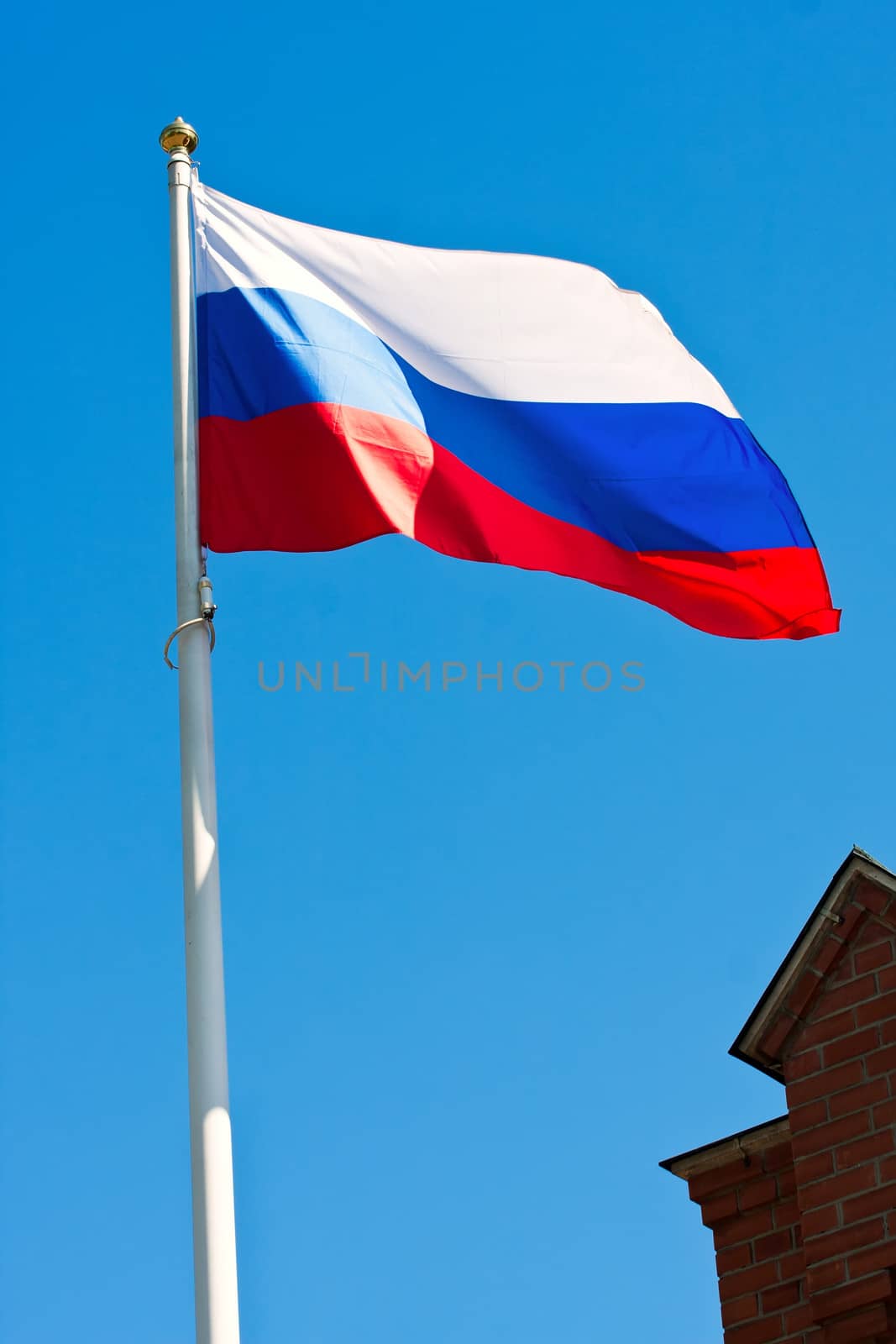 Russian flag on  background of blue sky