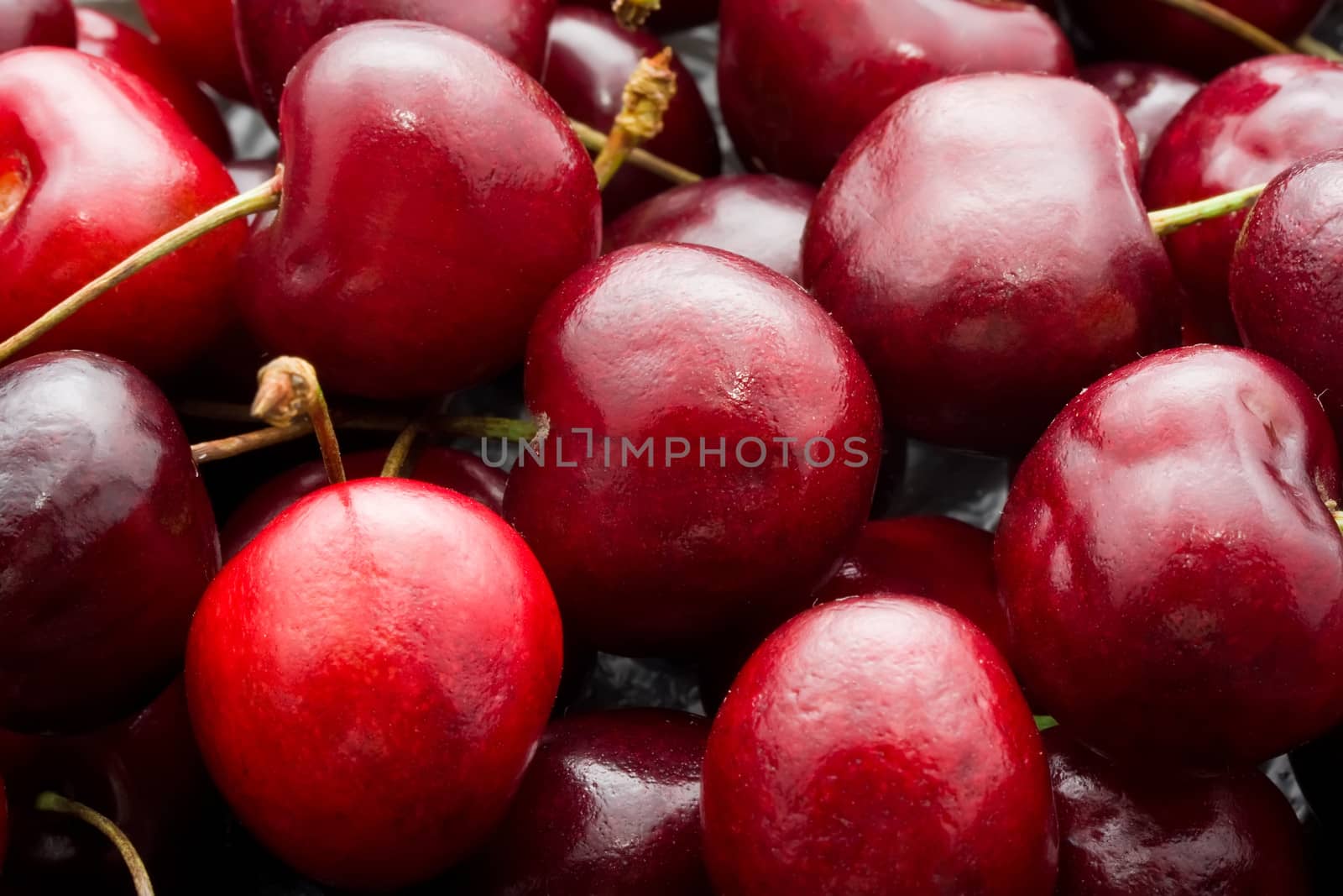 Beautiful red fresh cherry macro photo background