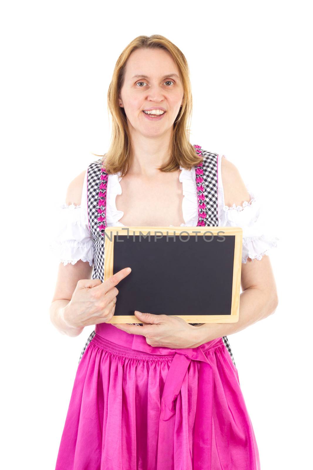 Bavarian woman pointing to clean blackboard