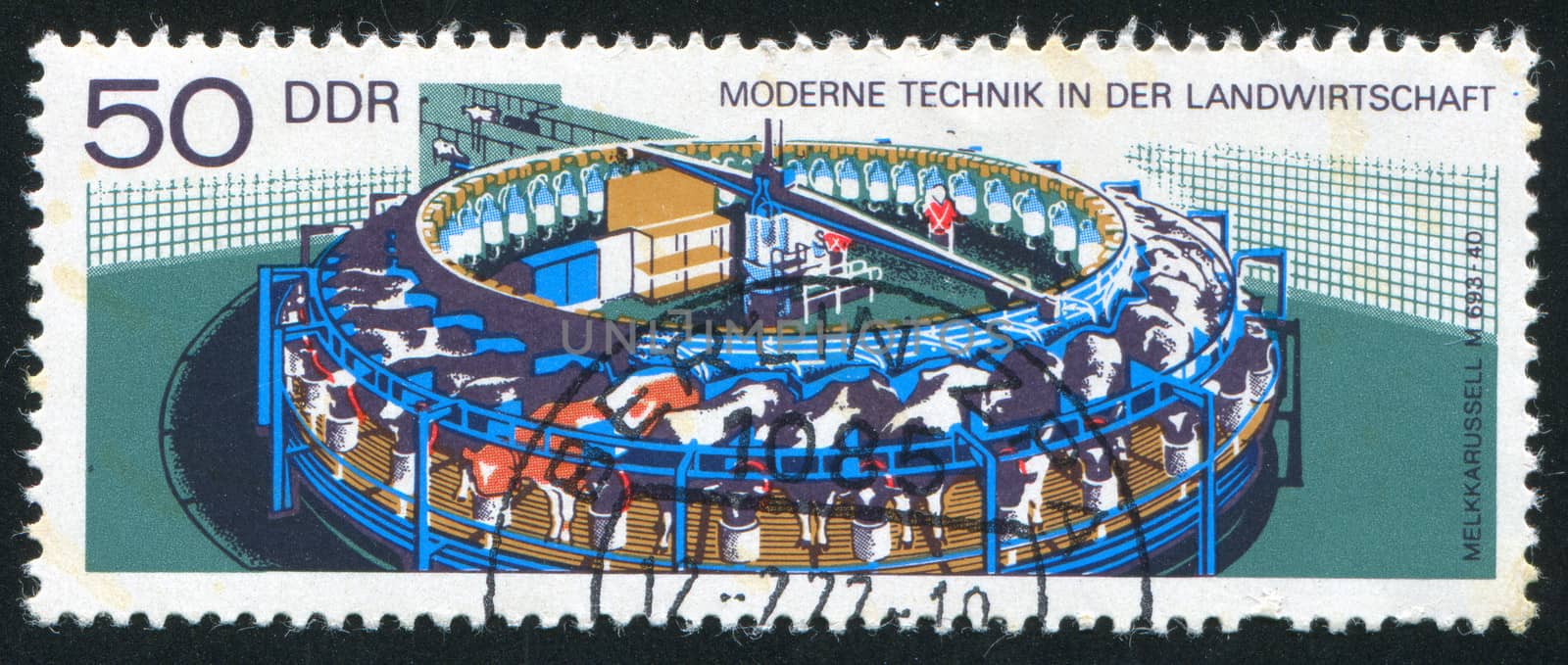 GERMANY - CIRCA 1977: stamp printed by Germany, shows Rotating milking machine, circa 1977