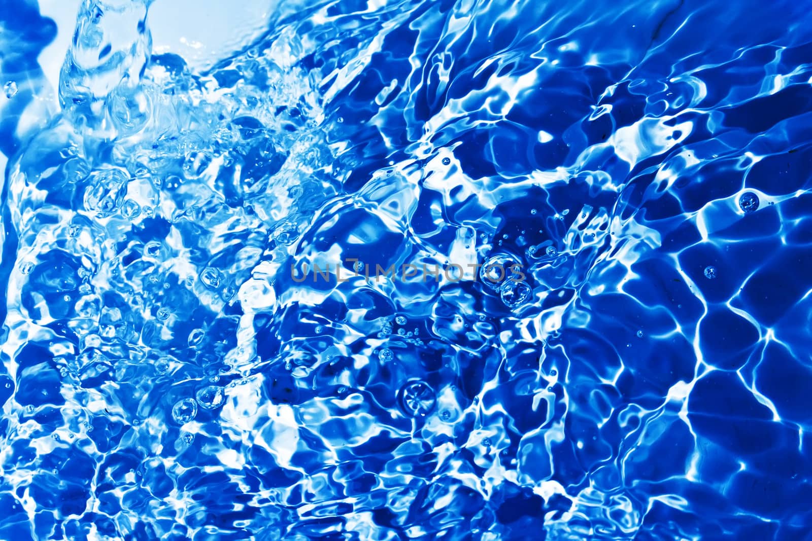 Blue transparent water splashes on white background