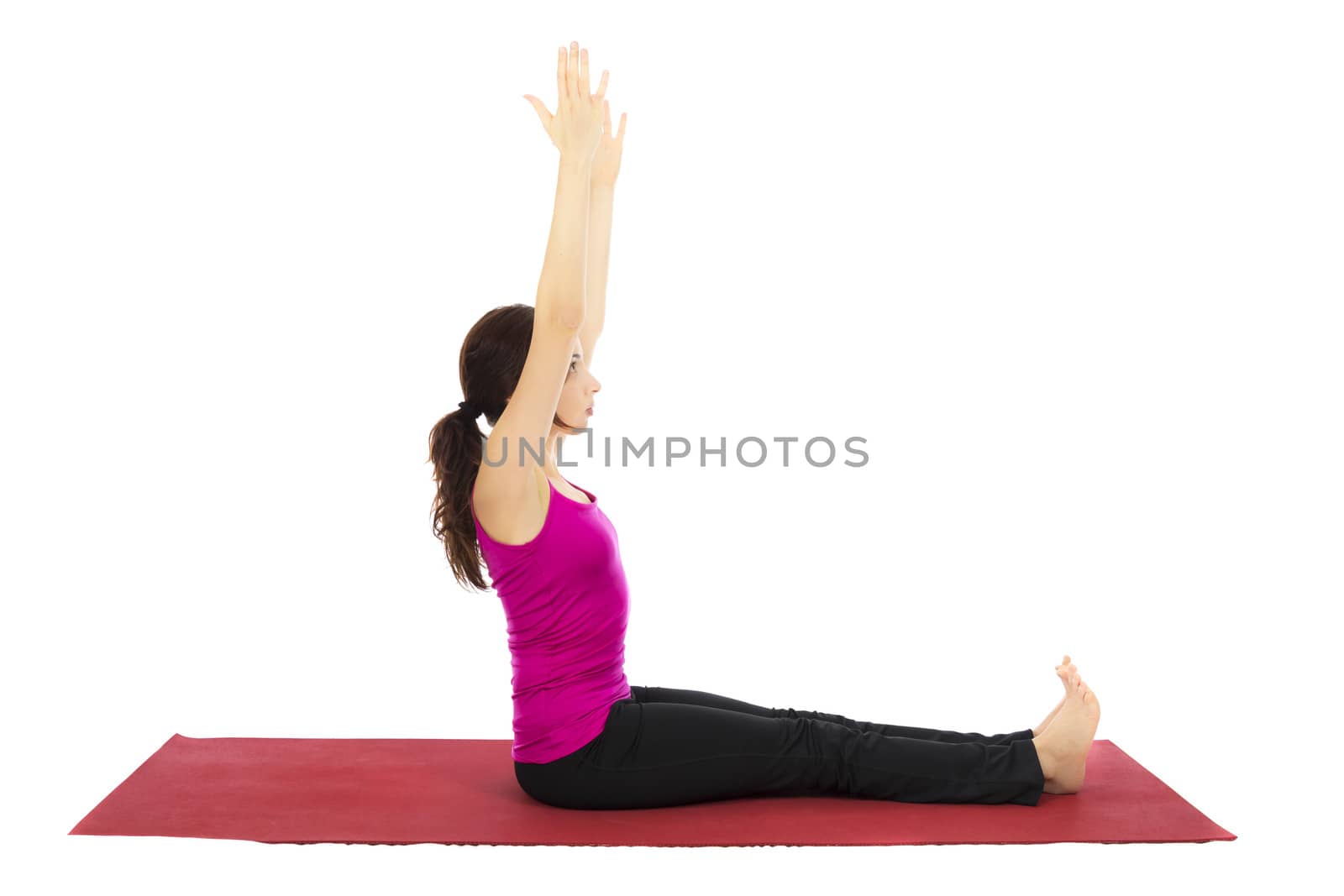 Young woman doing Staff Pose in Yoga (Series with the same model available)