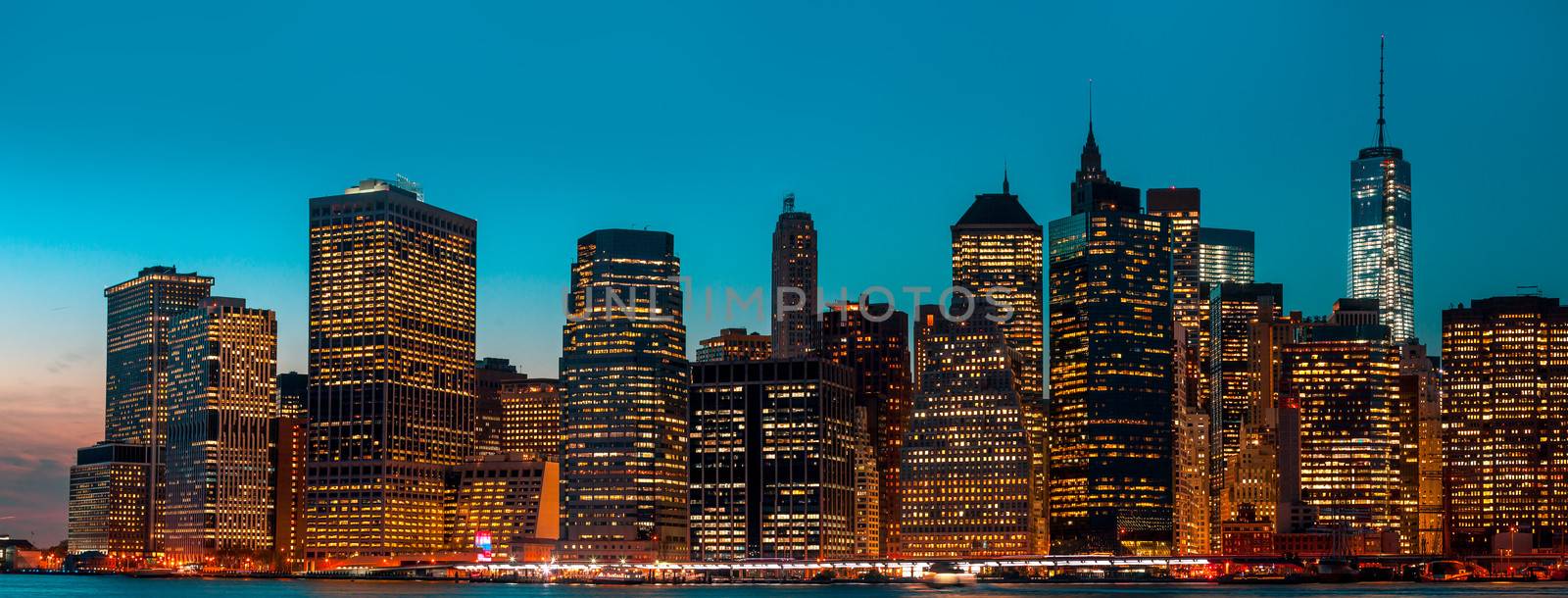 Manhattan at night with lights and reflections. New York City skyline